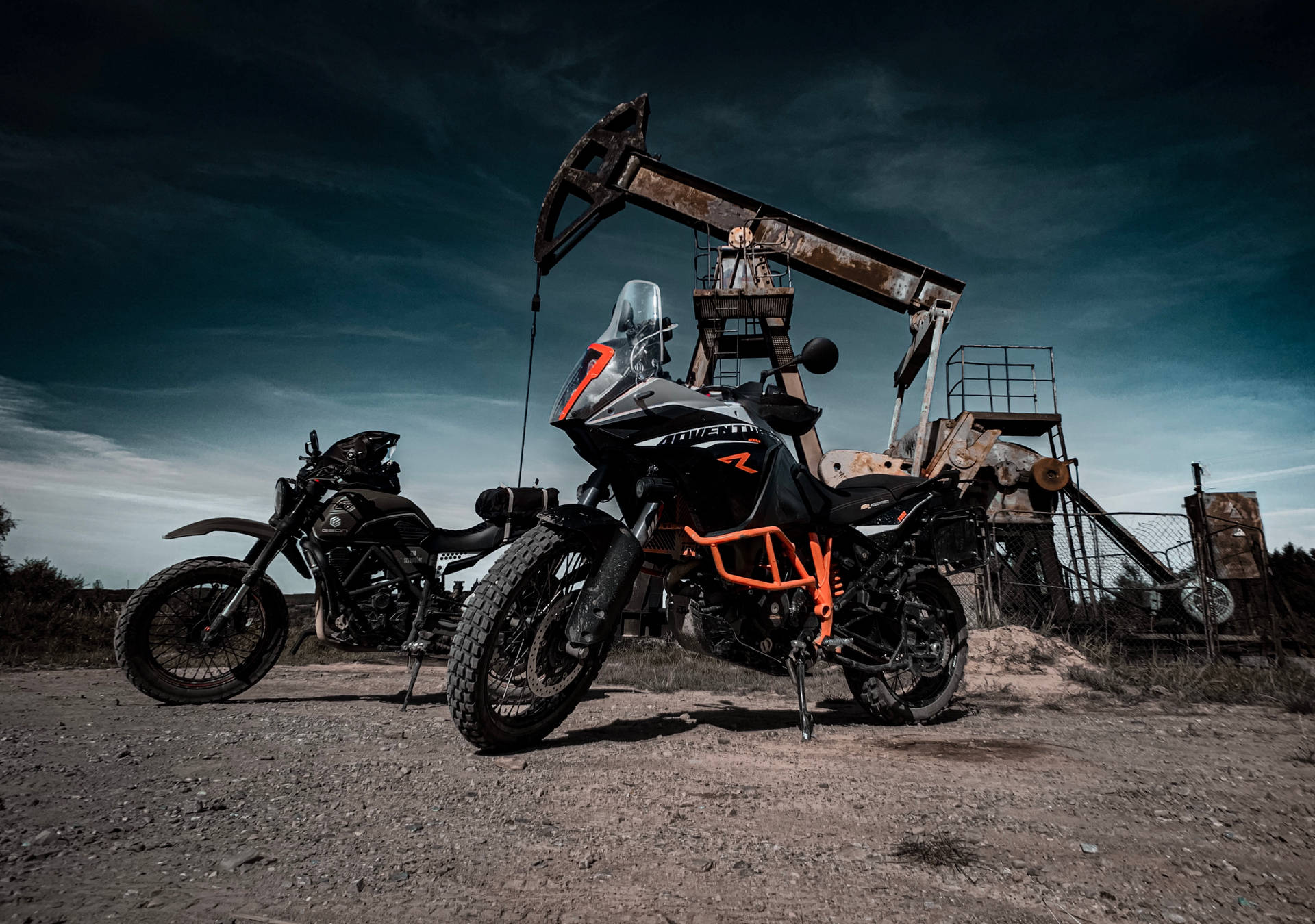 black and red naked motorcycle parked near brown wooden house during daytime