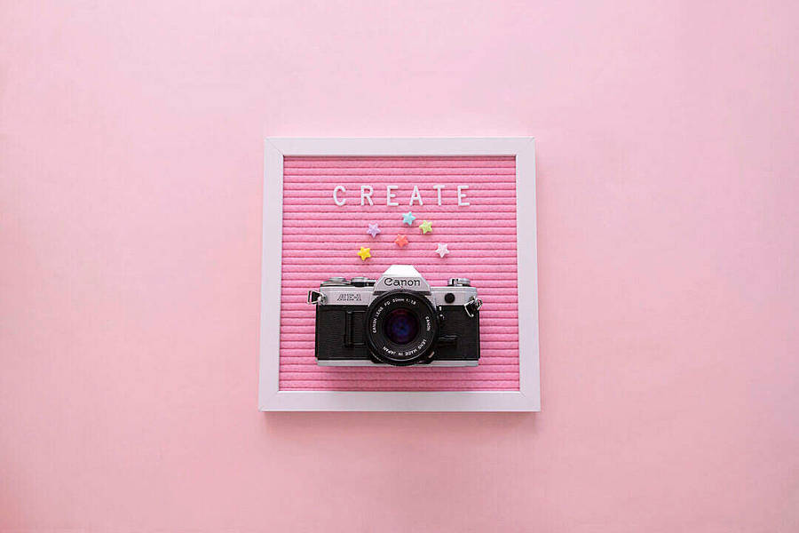 Download “Create” Word on Pink Letter Board with Camera FREE Stock Photo