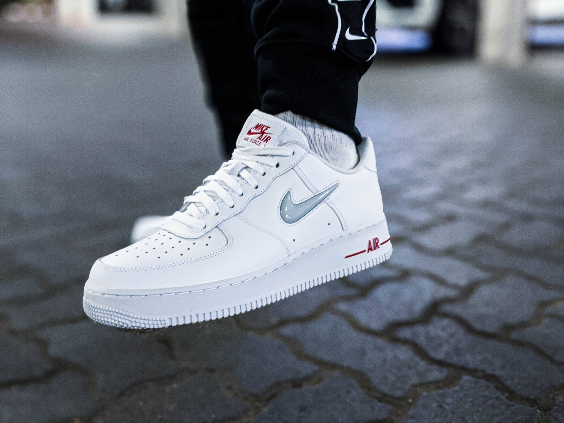 person wearing white nike air force 1