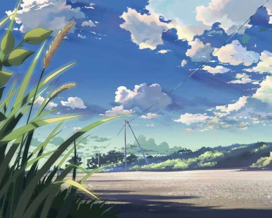 一條有草地和雲朵背景的道路 — 美學 iPad 壁紙