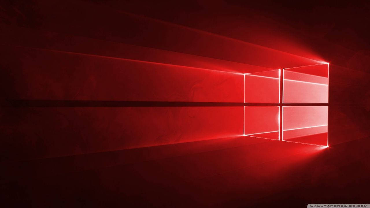 紅色發光Windows標誌在黑暗的數位空間中投射光束。