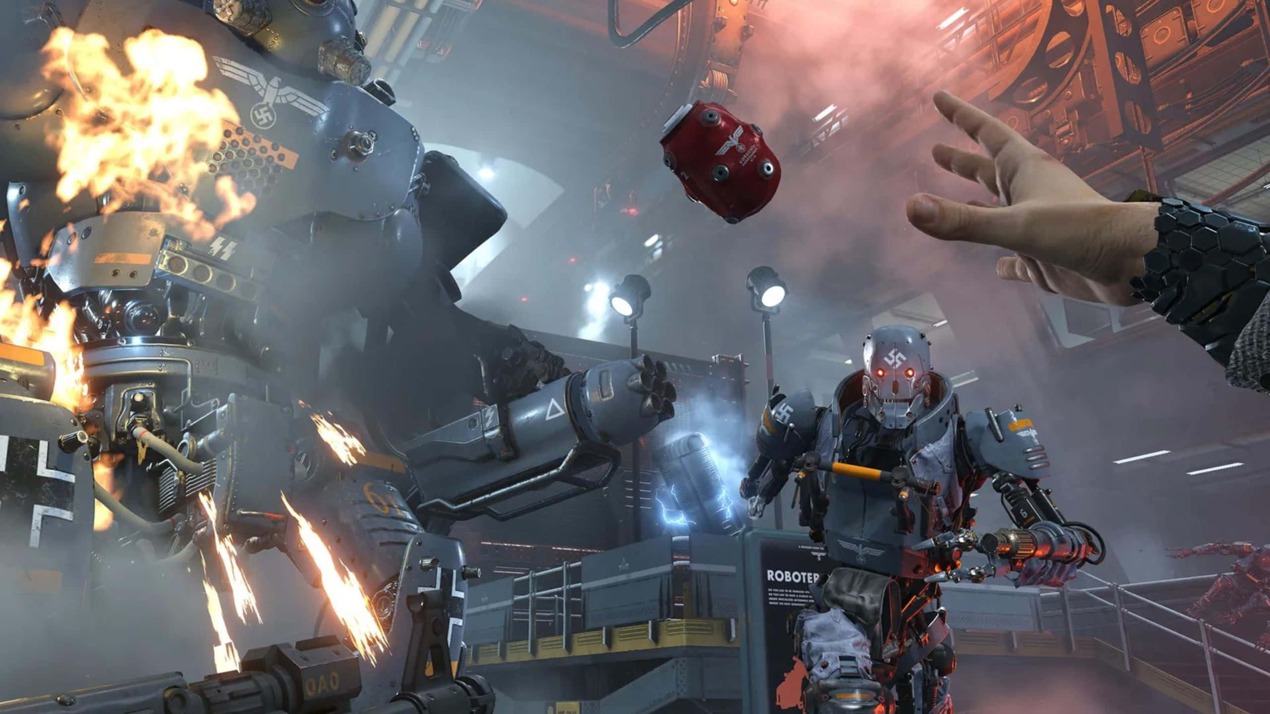1440p Wolfenstein II — 投擲手榴彈對敵背景 壁紙 — 一個巨大的燃燒機械人聳立在一個較小的裝甲人物之上，同時一隻人類的手在煙霧彌漫的工業環境中伸出。