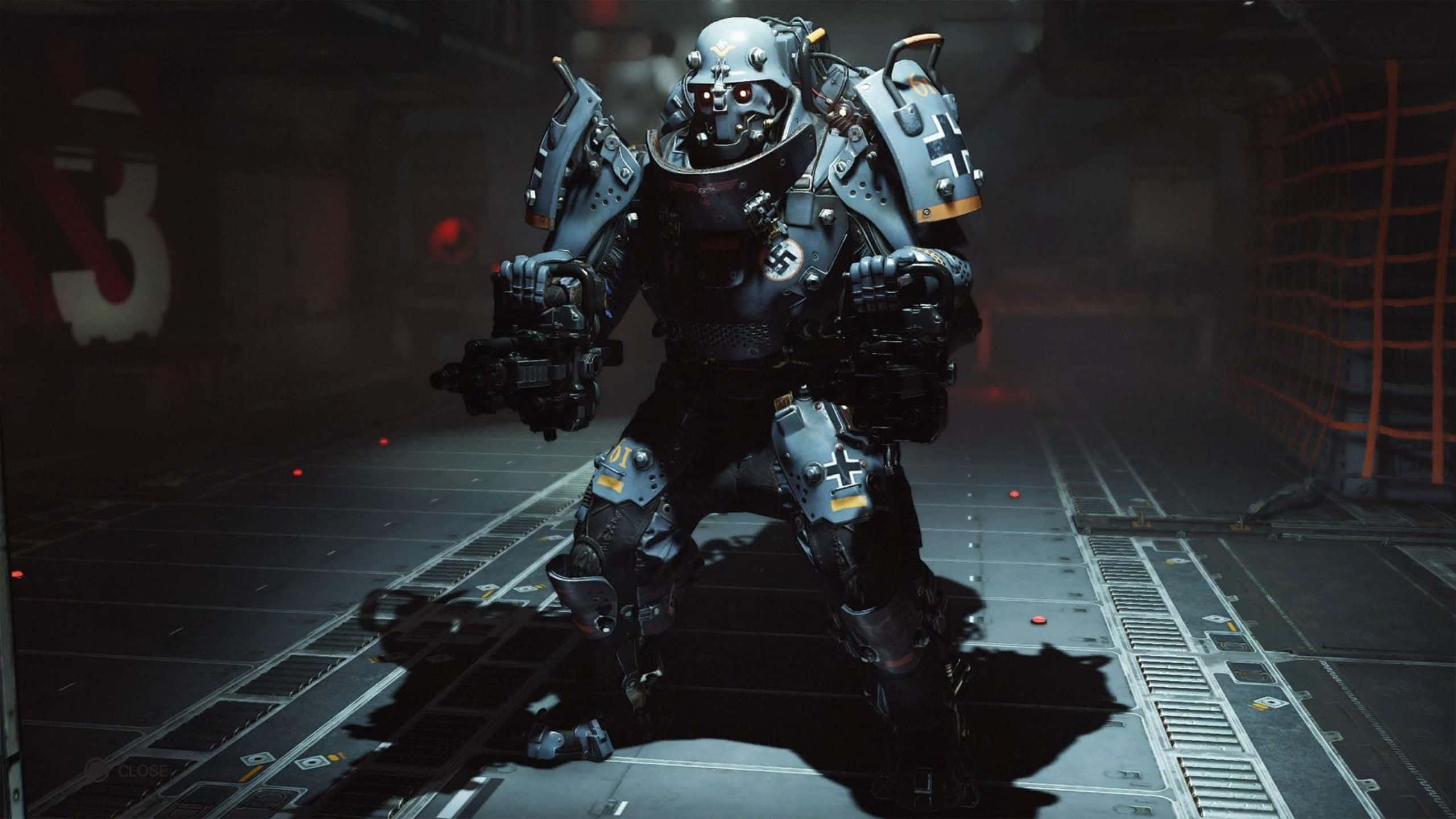 1440p《Wolfenstein II》超級士兵背景 壁紙 — 一名身穿重甲的未來戰士站在昏暗的工業走廊中，周圍有發光的紅燈和金屬地板。