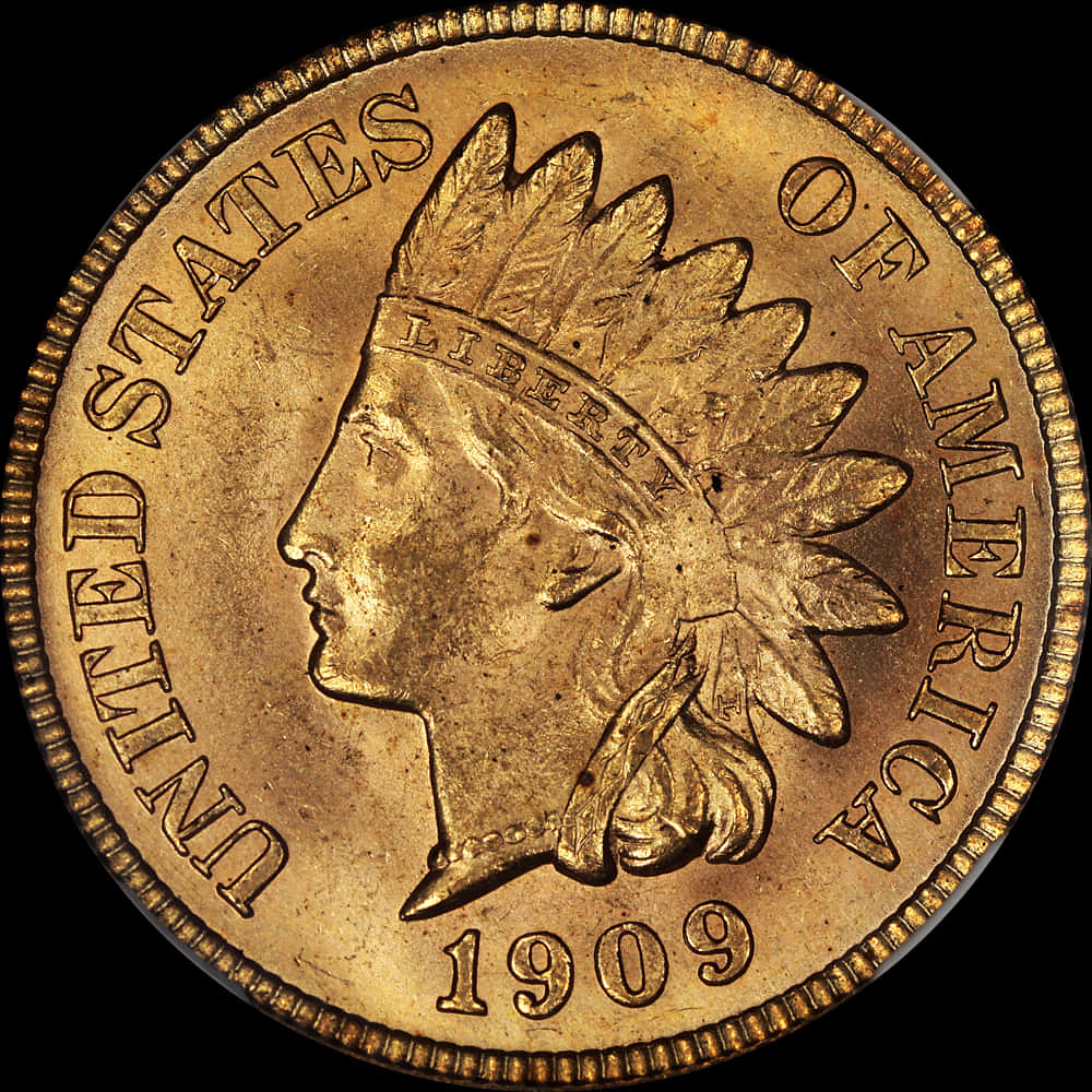 1909年印第安頭像金幣 壁紙 — 1909年美國印第安頭金幣特寫，顯示戴羽毛頭飾的原住民詳細側面，背景為黑色。