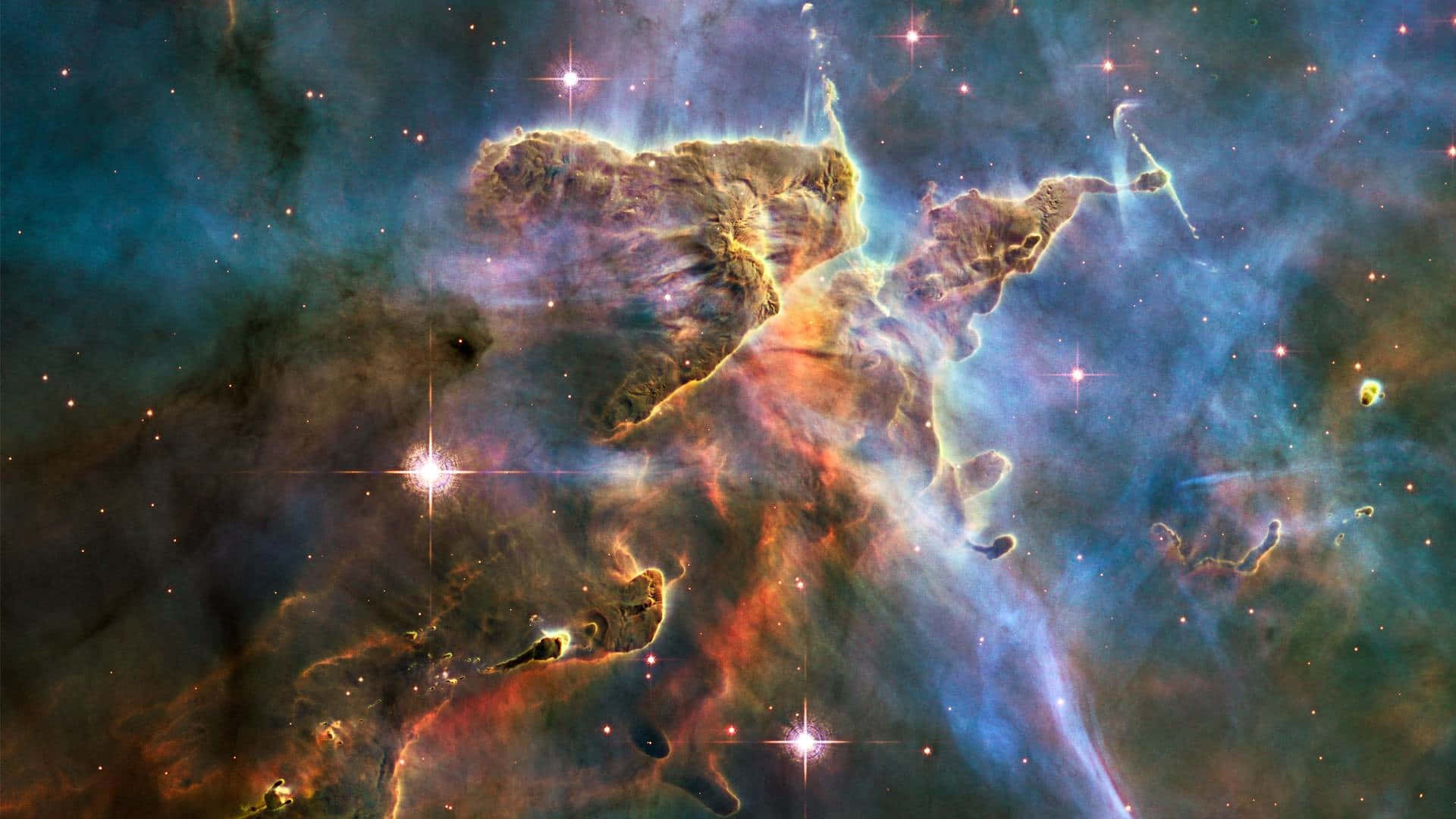 1920 X 1080 赫比亞卡里納星雲 壁紙 — 一個充滿活力的宇宙星雲，在黑暗太空背景下，明亮的星星照亮了發光的橙色和藍色雲層。