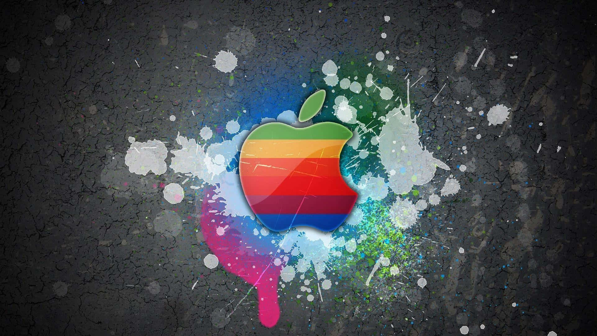 在裂開的深色表面上帶有油漆飛濺的彩色Apple標誌