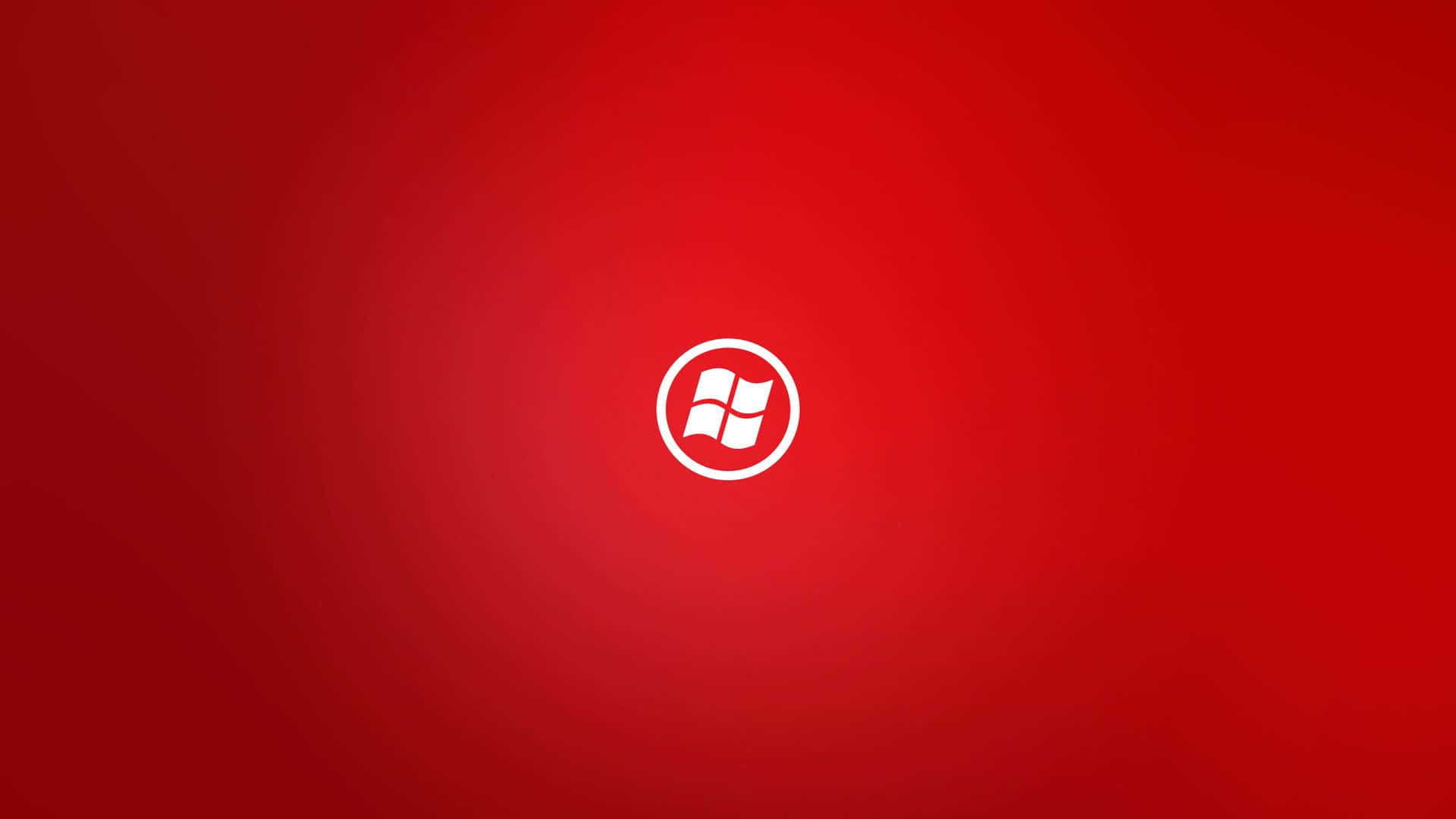 1920x1080 紅色 Windows 標誌 壁紙 — 一個簡約的白色Windows標誌，居中放置在漸變紅色背景上。