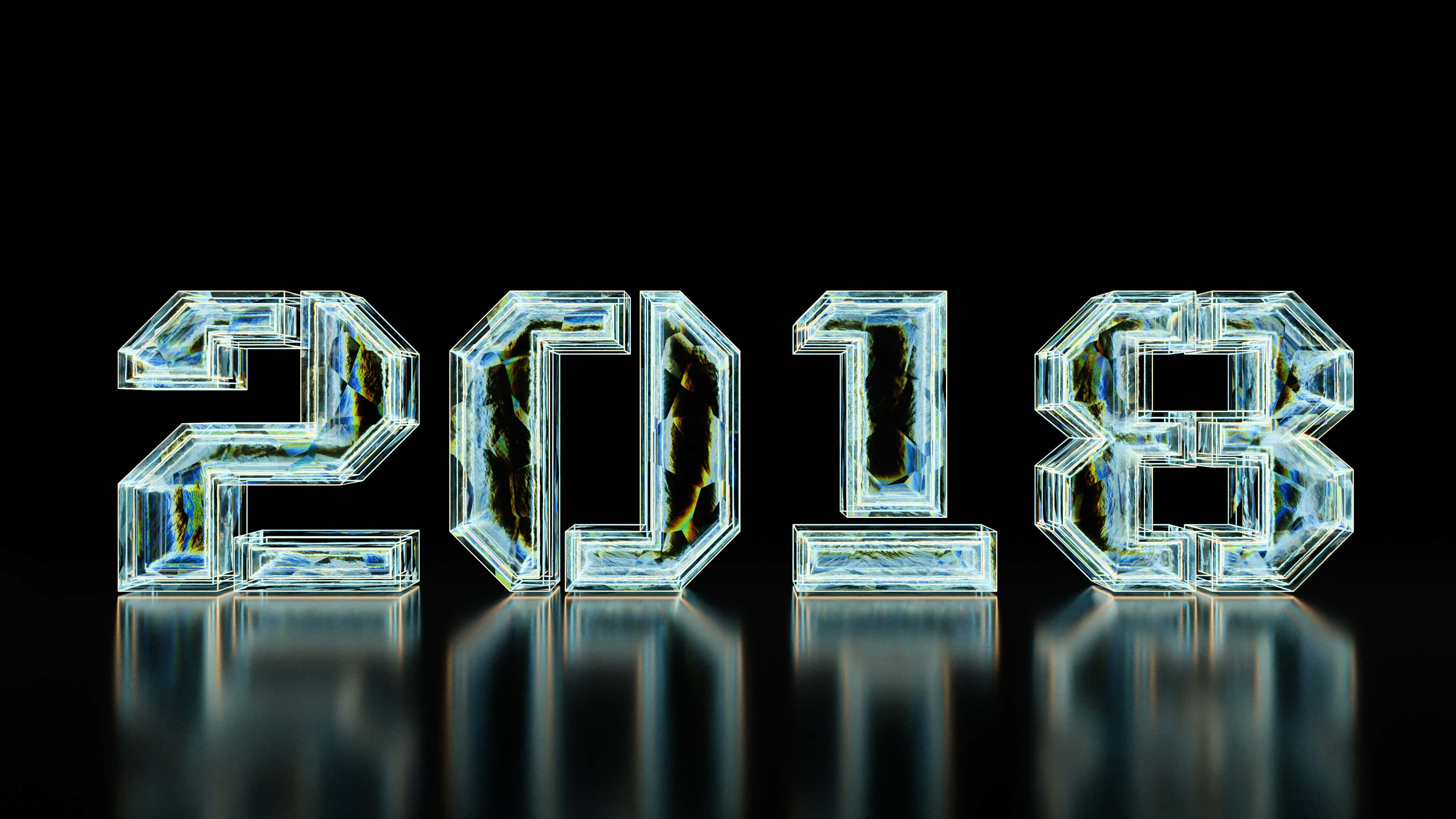 2018 桌布 壁紙 — 2018年以半透明玻璃塊呈現，內部有裂紋和反射，置於黑色表面上。