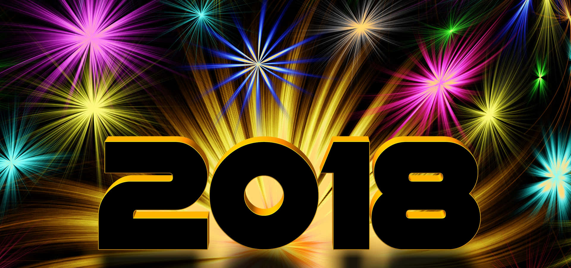 大膽的2018文字帶有金色亮點，在黑色背景上被彩色煙花環繞。