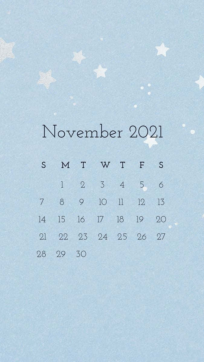 2021年11月月曆，白色星星點綴在淺藍色紋理背景上。