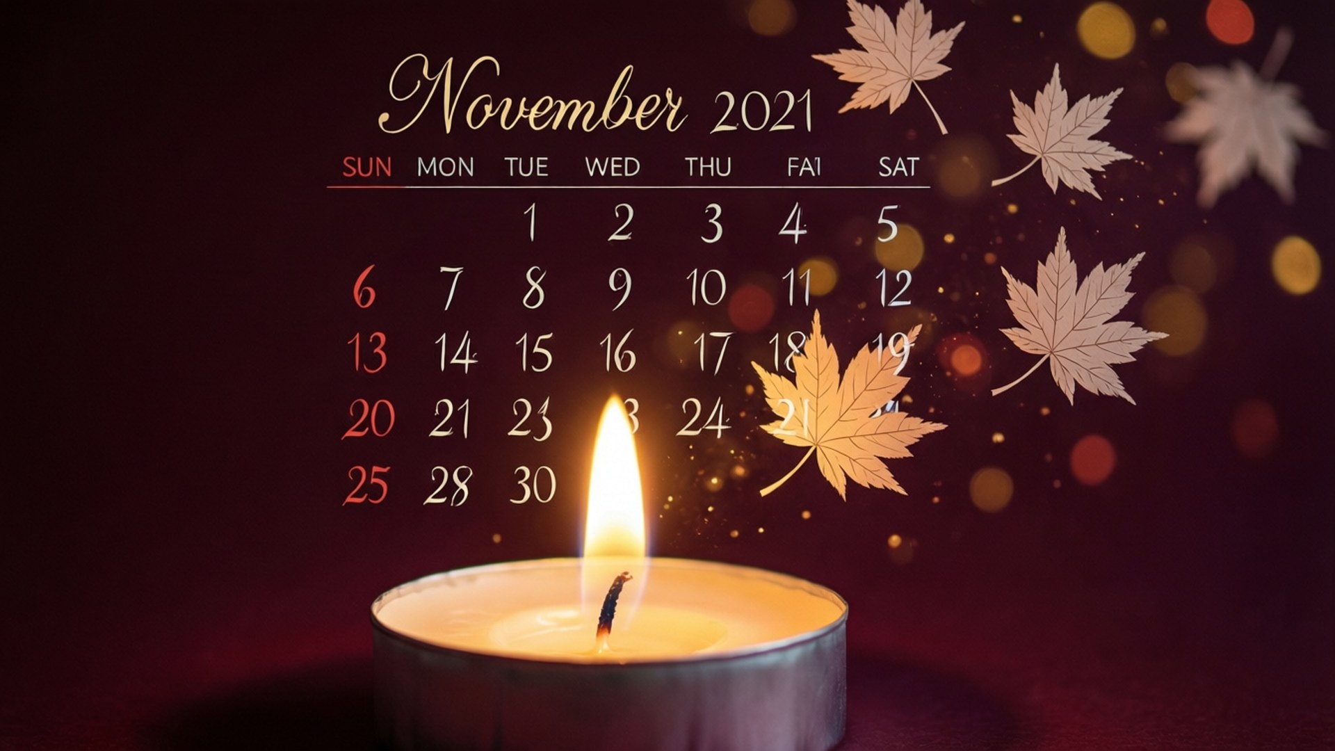 一支點燃的蠟燭，配以2021年11月的日曆和飄落的楓葉，呈現溫暖的散景效果。