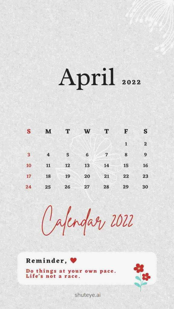 簡約白紅四月2022日曆 壁紙 — 簡約風格的2022年4月月曆，帶有花卉圖案和勵志名言，背景為紋理灰色。