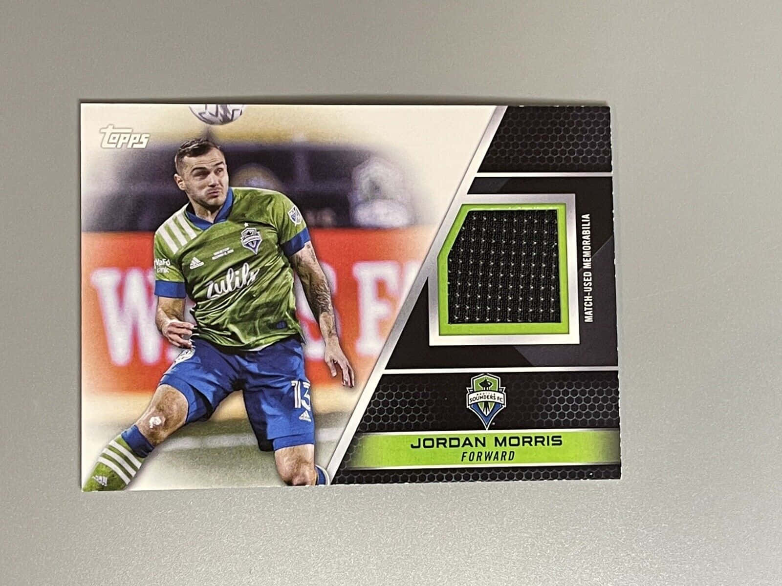 Jordan Morris 的足球交換卡，帶有比賽用球衣貼片。