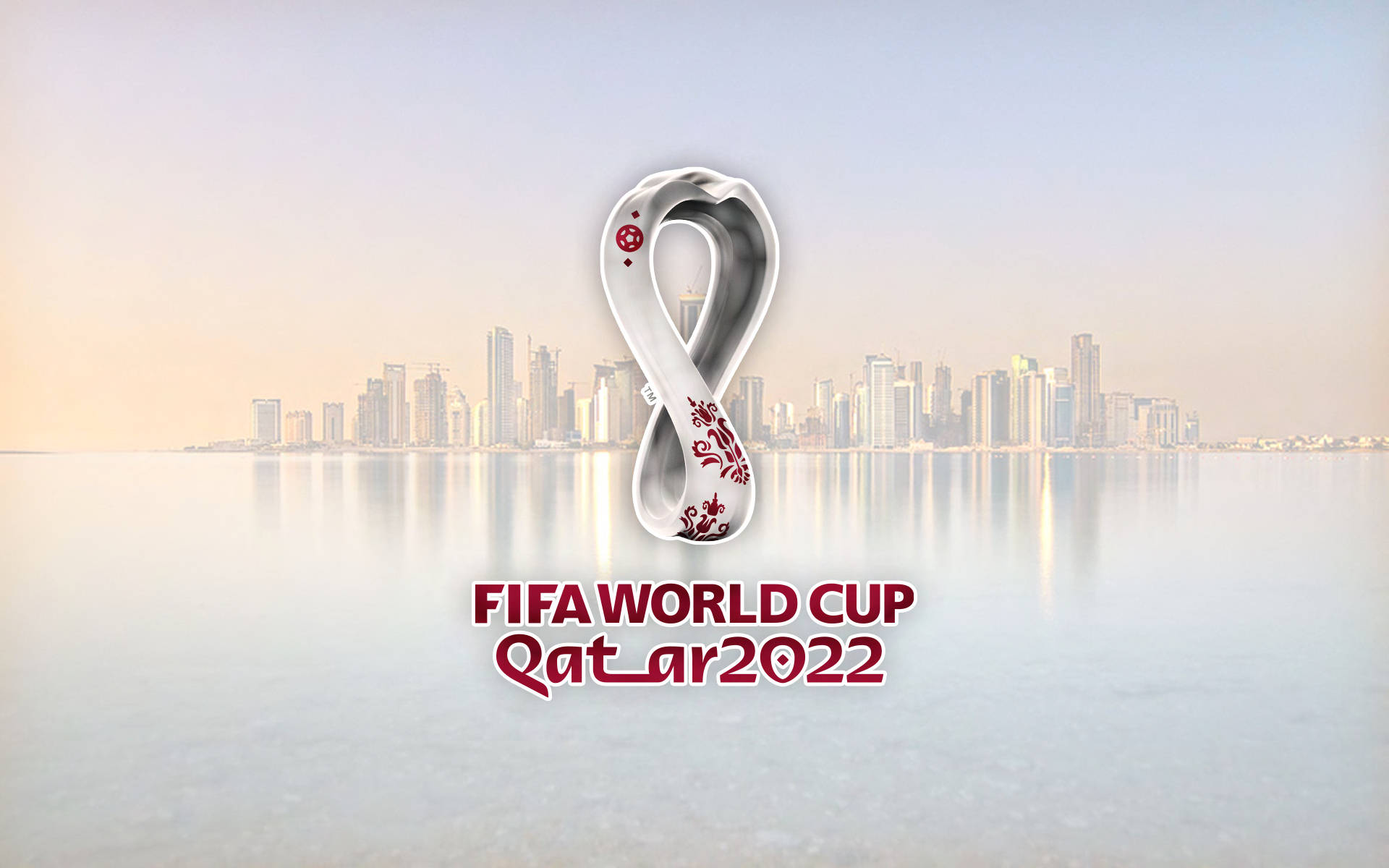 FIFA世界盃卡塔爾2022標誌在黎明時分現代城市天際線之上。