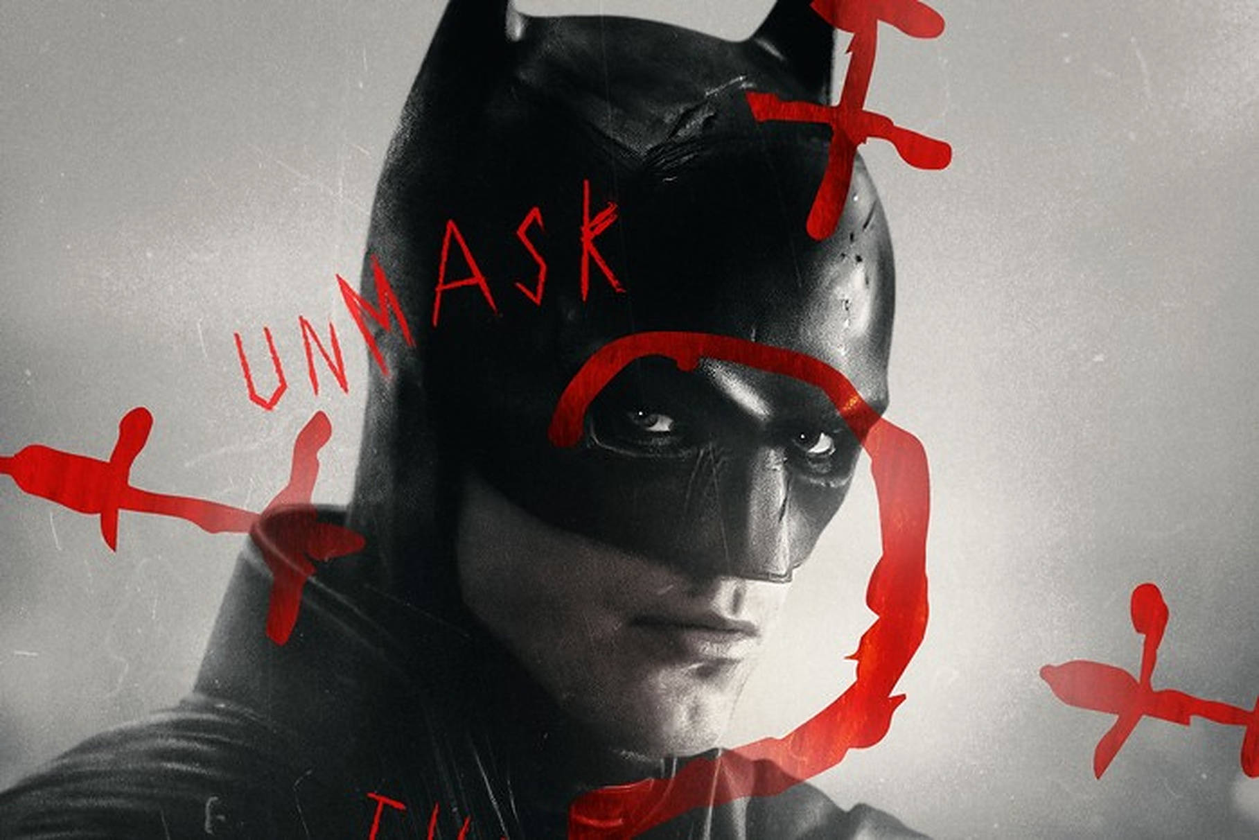蝙蝠俠著住深色西裝，紅色塗鴉喺佢嘅面上寫住 'UNMASK'。 — 蝙蝠俠 2022 壁紙