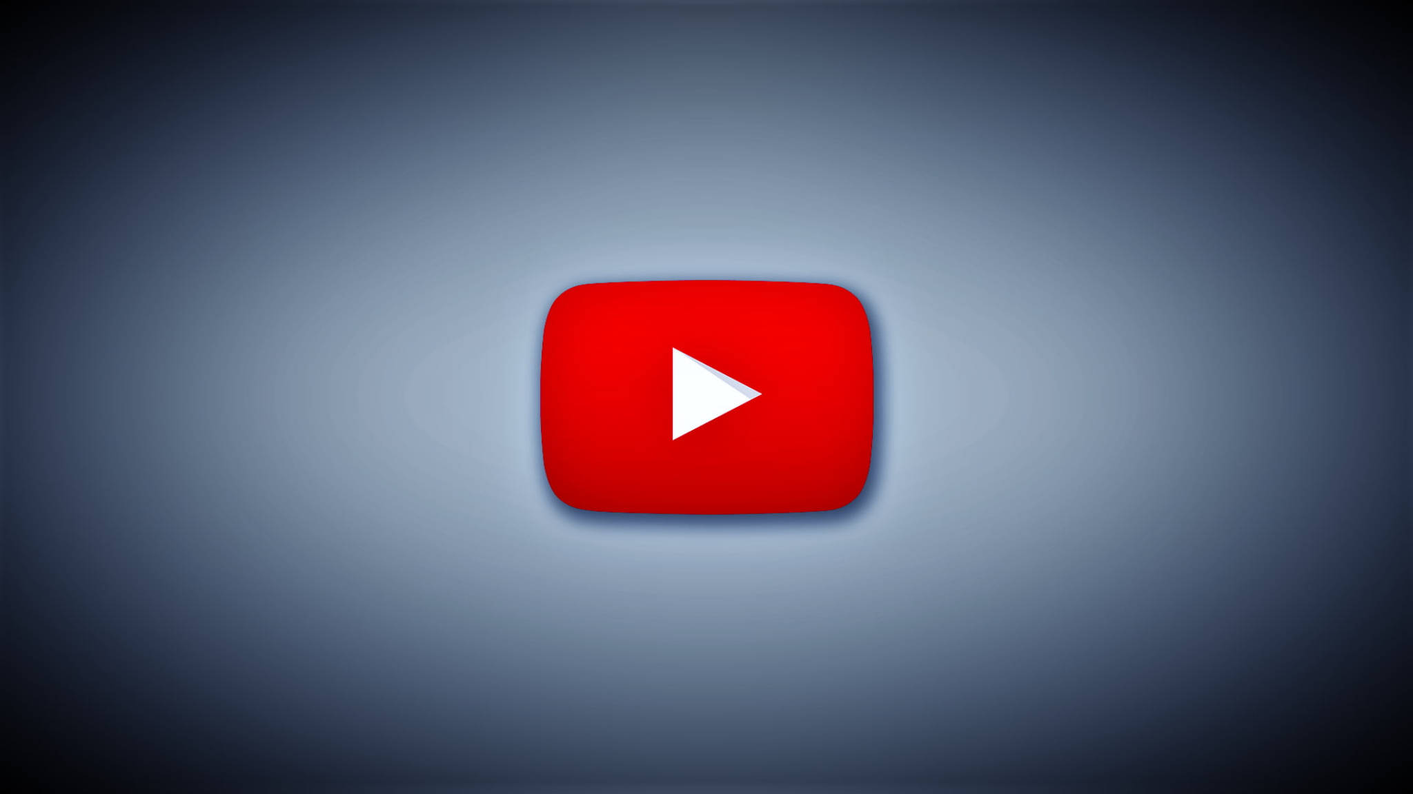 深色 2048x1152 YouTube 桌面 壁紙 — 一個發光的紅色YouTube播放按鈕圖示，居中於漸變藍色背景上。