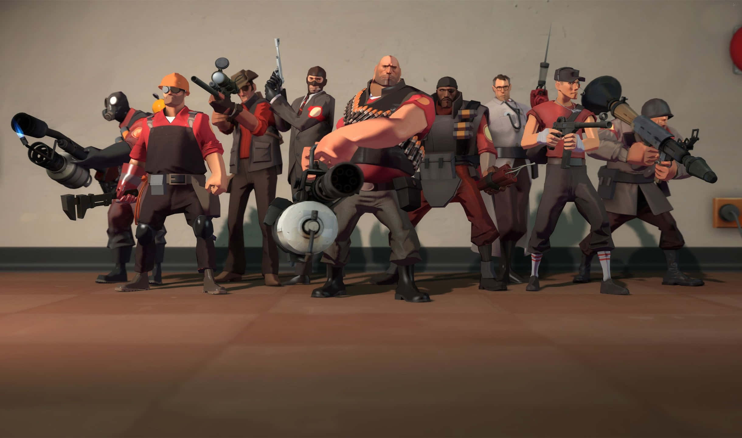 2440x1440 Team Fortress 2 紅隊角色背景 壁紙 — 一群風格化的電子遊戲角色身穿戰鬥裝備，在簡單的室內環境中手持武器擺姿勢。