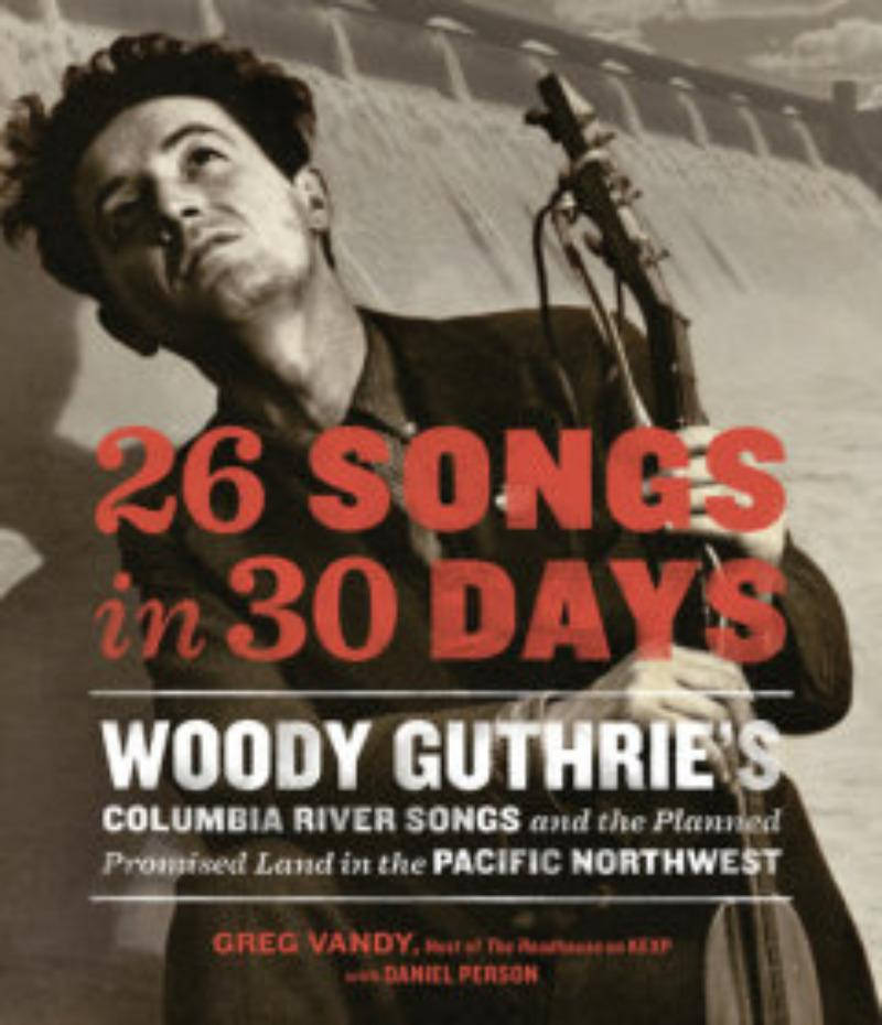 26首歌30天 伍迪·蓋瑟瑞 壁紙 — 伍迪·蓋瑟瑞（Woody Guthrie）拿著結他的棕褐色調肖像，上面有粗體紅色文字，宣佈他的哥倫比亞河歌曲項目。