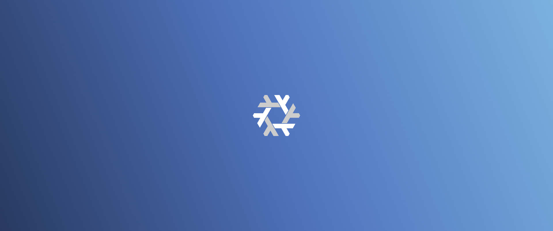 一個銀色雪花圖示在漸變藍色背景上。
