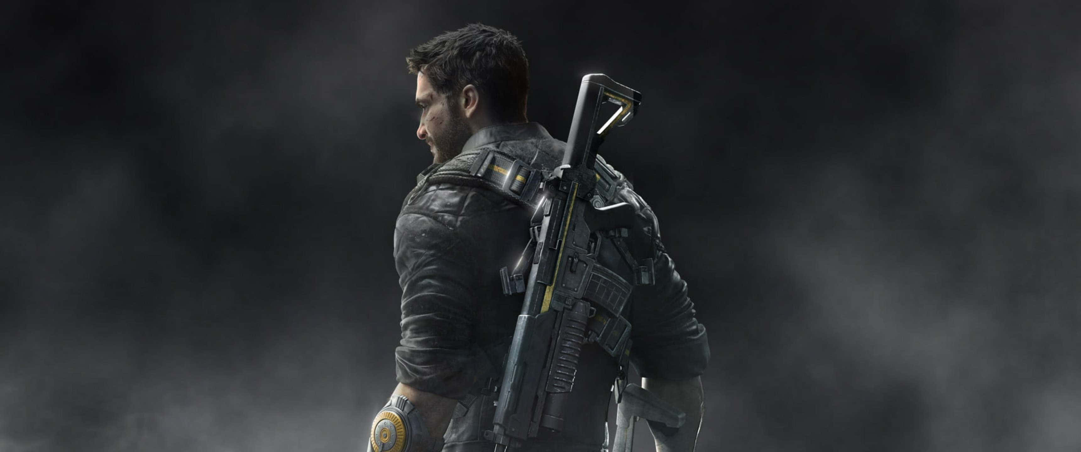 3440x1440p《Just Cause 4》主角背景 壁紙 — 一名身穿戰術裝備的士兵在煙霧瀰漫的黑暗中，以堅定的目光握著步槍站立。