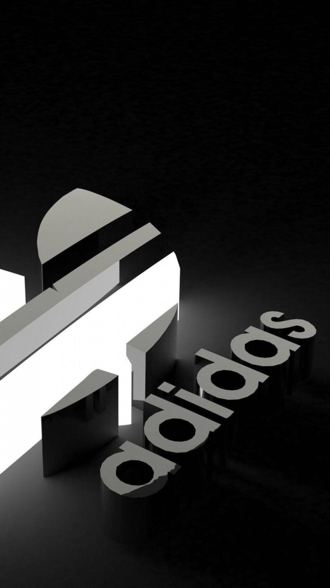 一個極簡的3D adidas標誌，在深色背景上帶有白色和黑色元素。