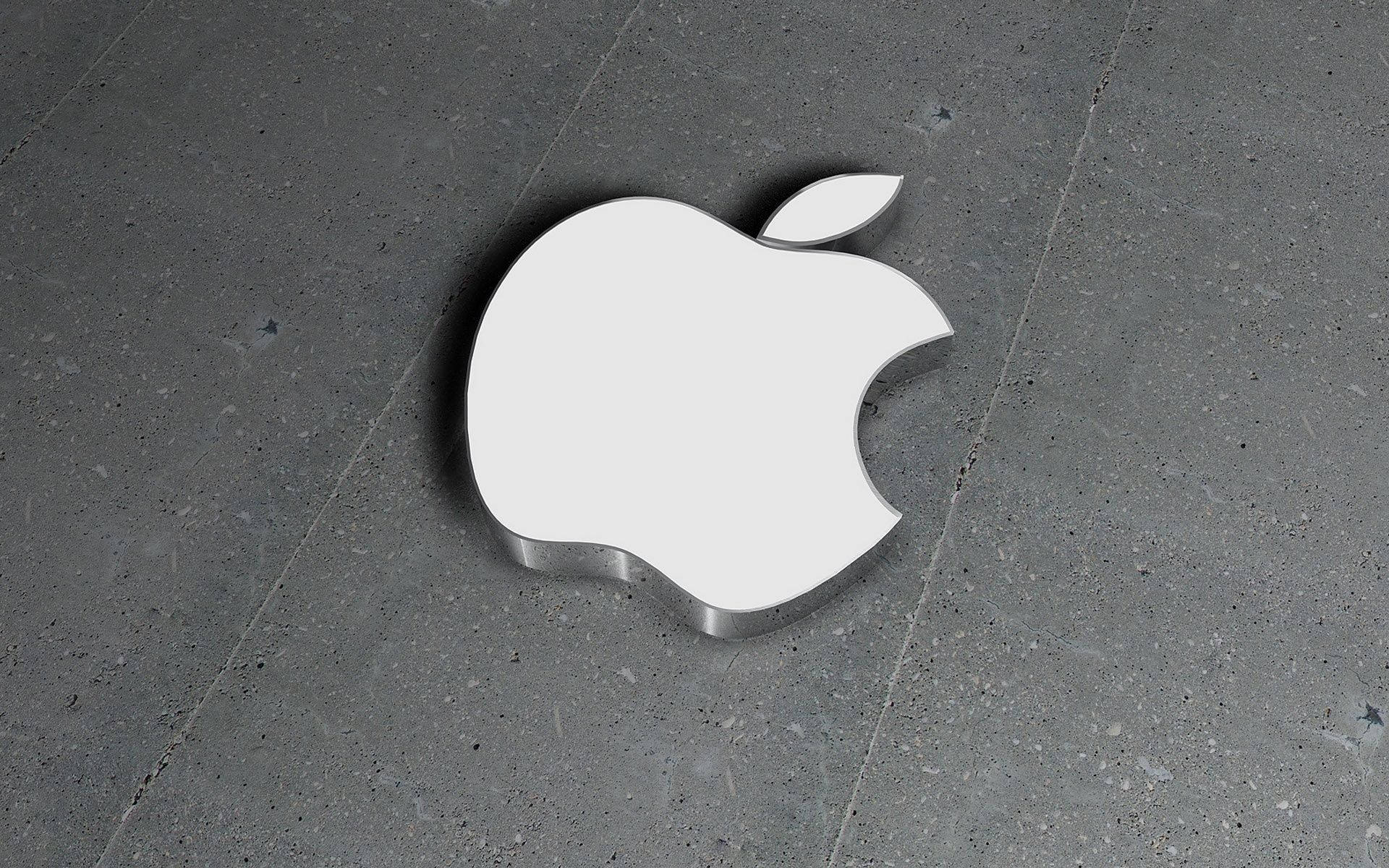 灰色混凝土地板上的Apple標誌
