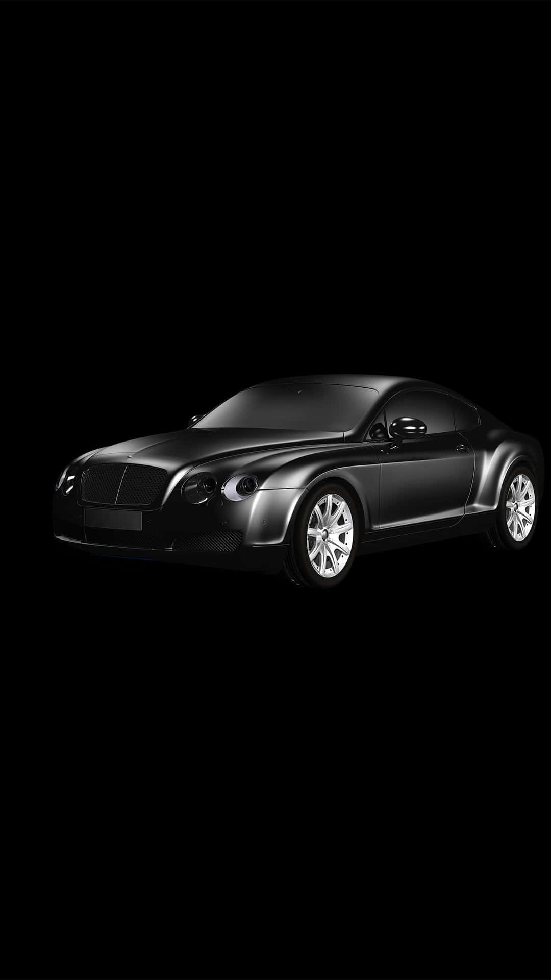 一輛黑色賓利 Continental GT 跑車孤立在黑色背景上。