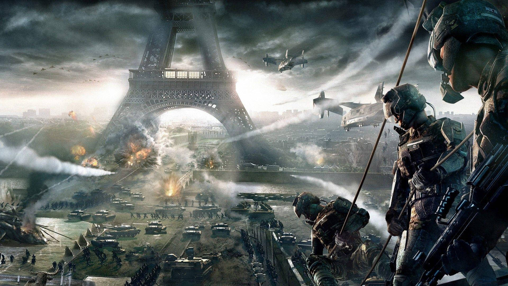 最佳3D遊戲《現代戰爭3》 壁紙 — 穿著未來裝備的士兵在戰火摧殘的巴黎前進，艾菲爾鐵塔在爆炸和飛行車輛中崩塌。