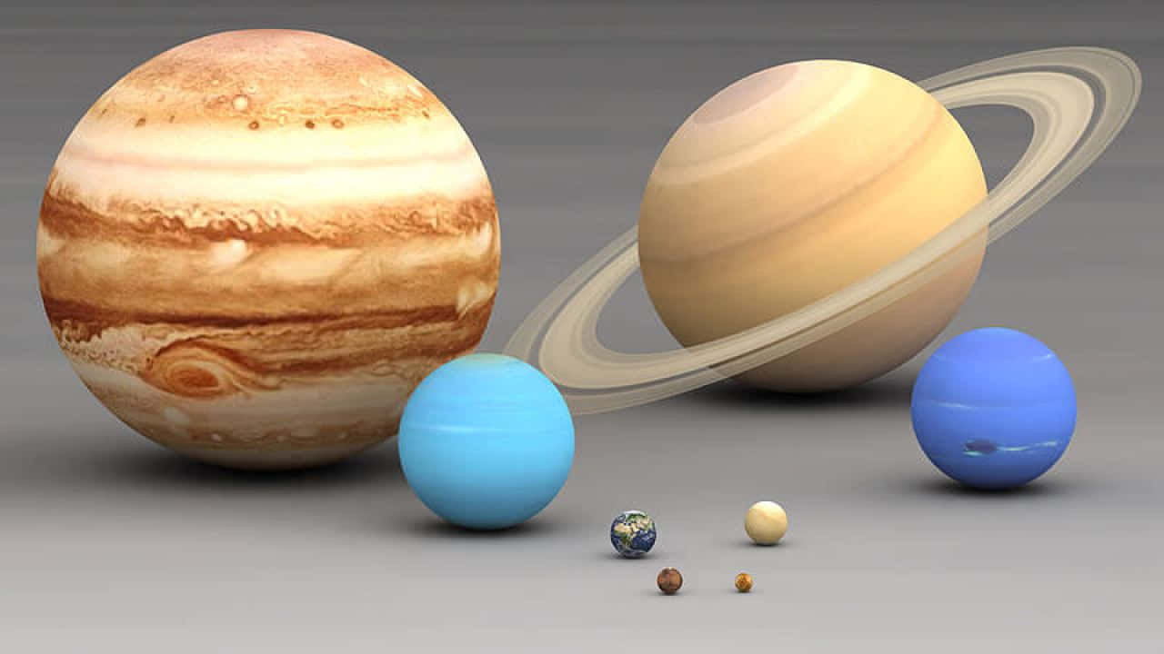 一個3D渲染的行星集合，包括木星和土星及其光環。