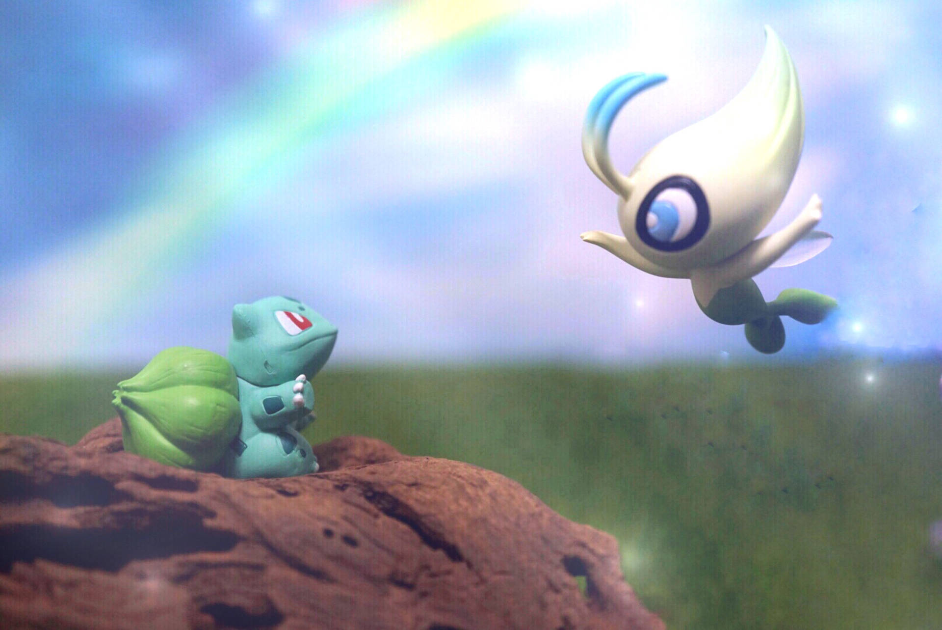 Bulbasaur 同 Lumiose 喺草地嘅彩虹下相遇。