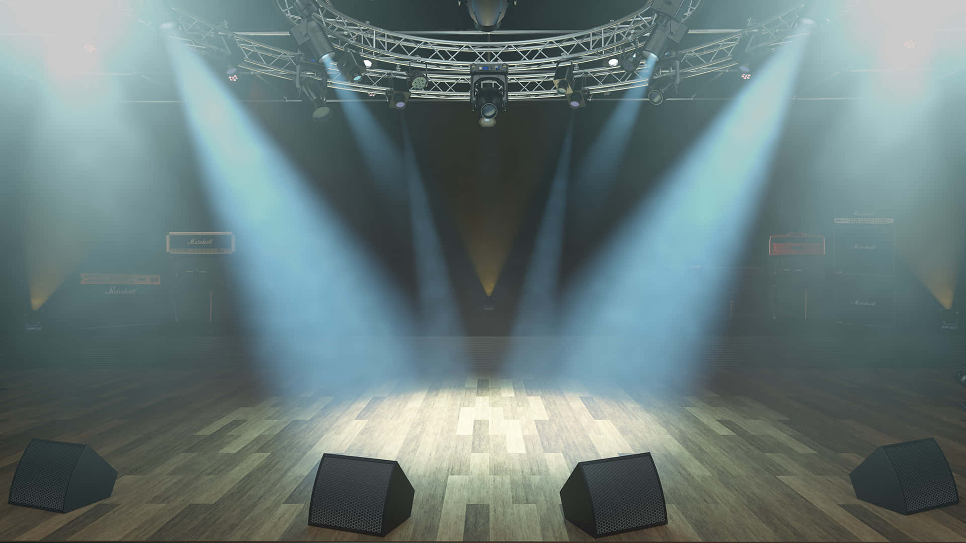 空蕩的音樂會舞台，配有聚光燈和 Marshall 擴音器。