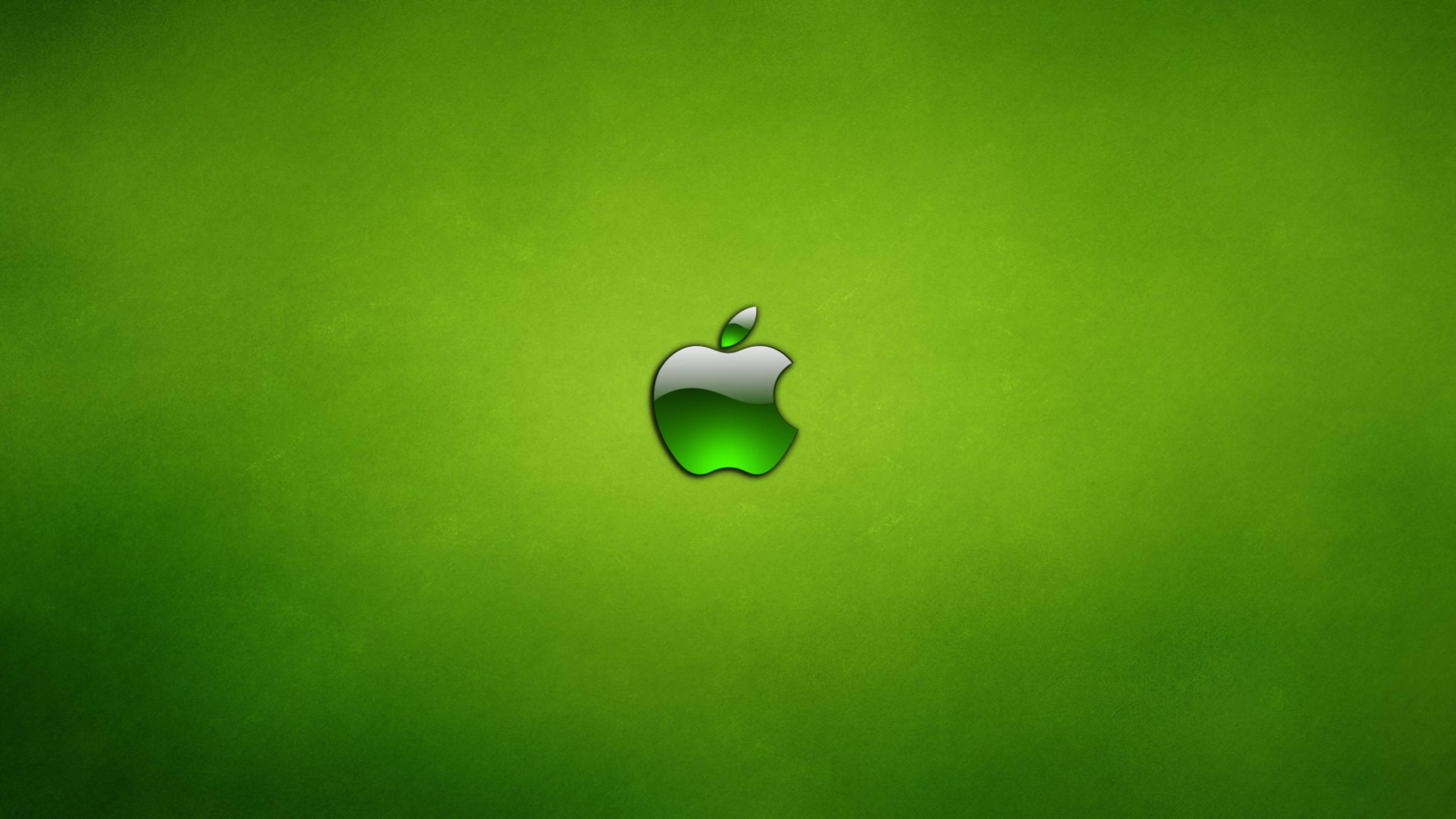 蘋果4K超高清霓虹綠 壁紙 — 一個光澤的Apple標誌置於有紋理的綠色漸變背景中央。