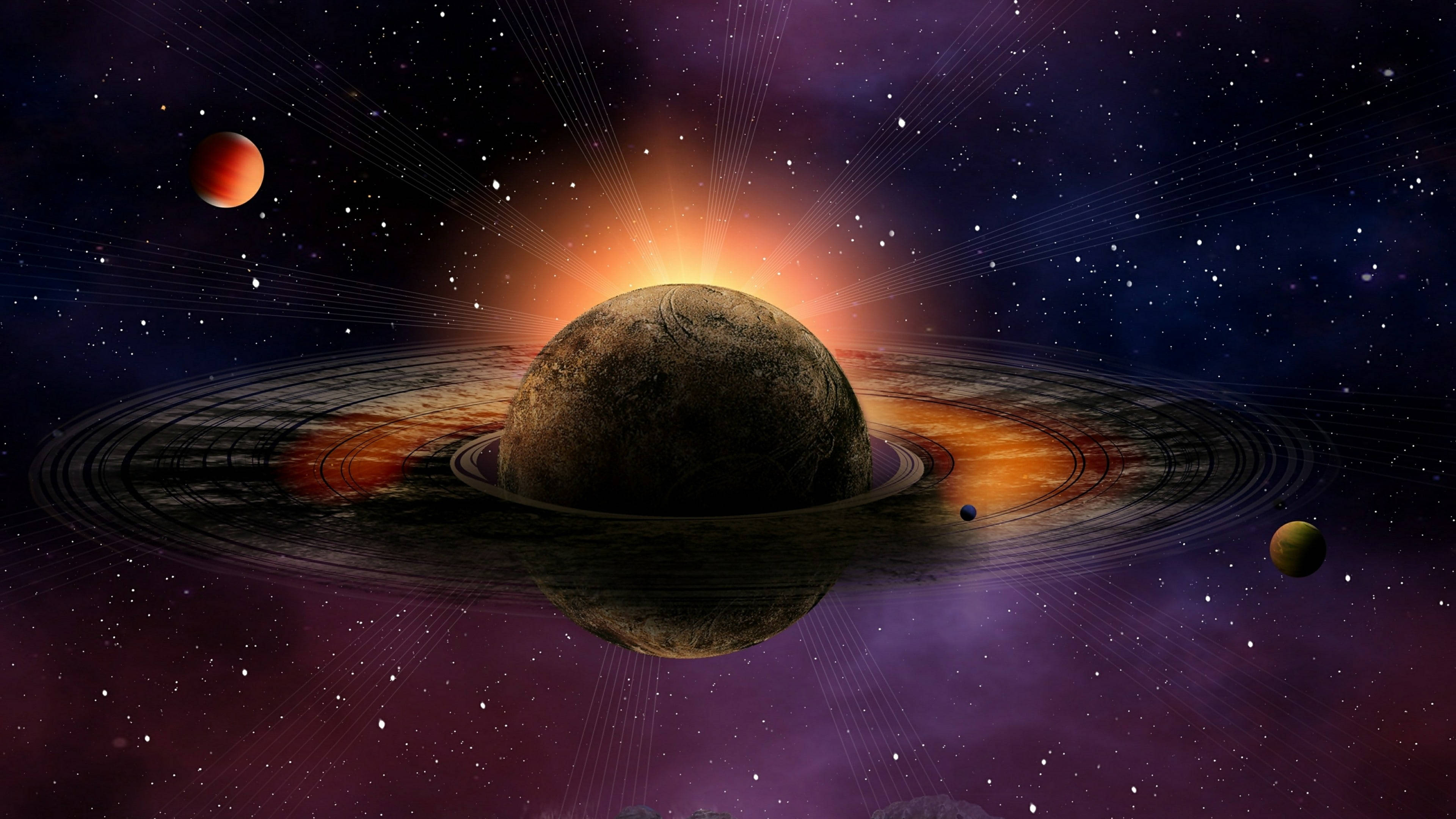 壯觀土星 4K 壁紙 — 一顆宏偉的環狀行星在星光宇宙背景下發出燦爛的太陽光芒，並有繞行的衛星。