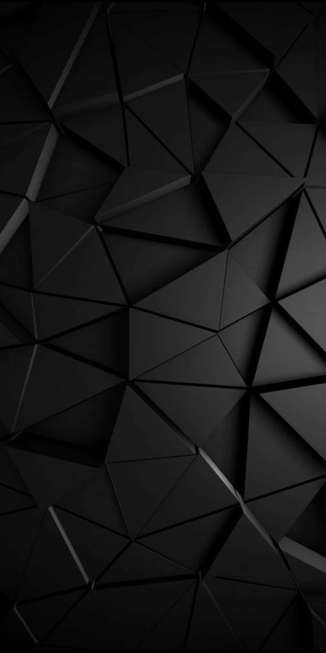 4K AMOLED 背景：黑色三角形磚塊 壁紙 — 時尚黑色幾何牆紙，帶有銳利的三角形切面和微妙高光，營造出現代抽象紋理。