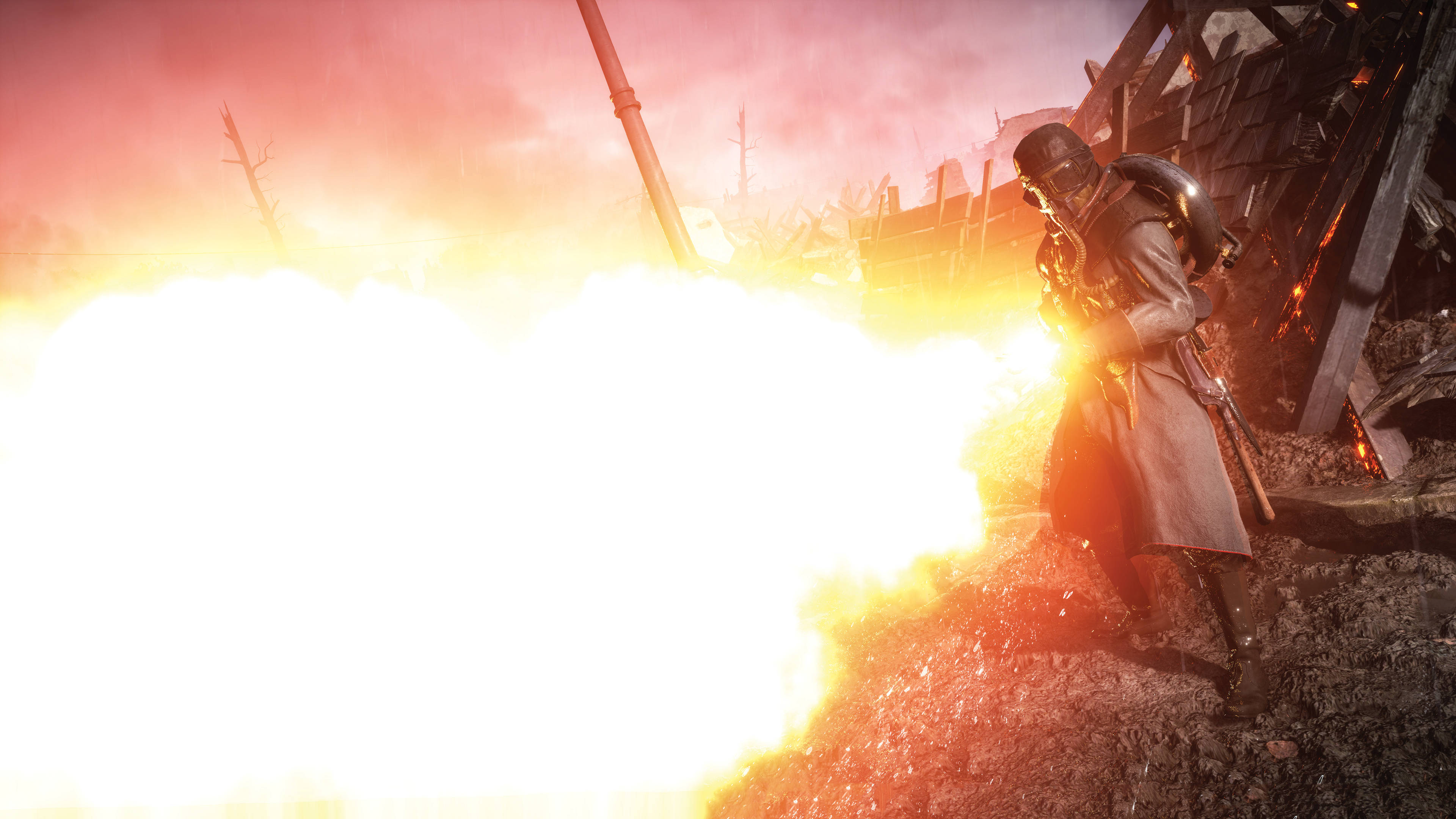 4K BF1 德國士兵使用Wex火焰噴射器 壁紙 — 一名戴面具的戰士在血橙色天空下的廢墟戰場中，於猛烈爆炸中開火。