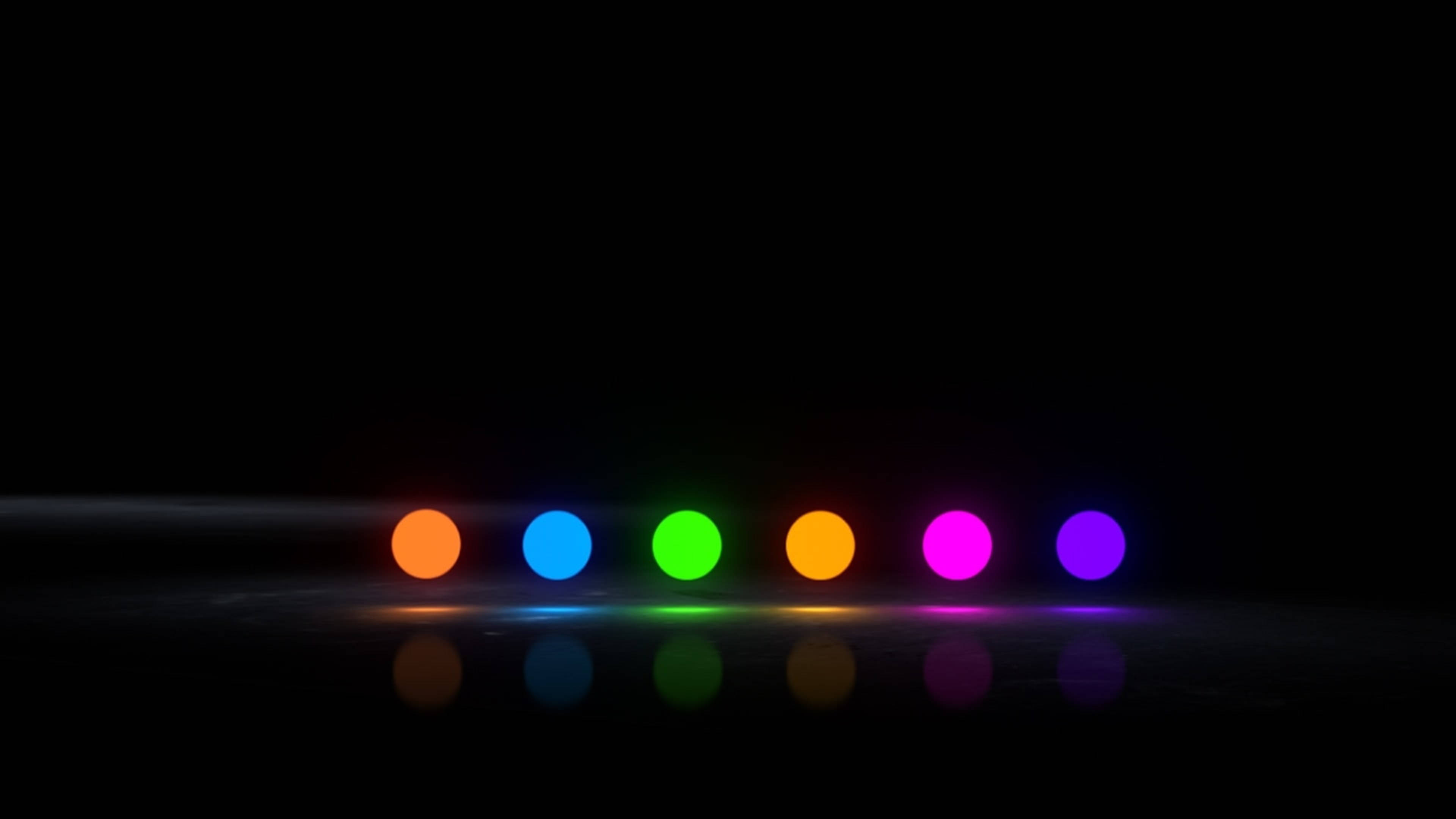 標題：鮮豔霓虹點陣 4K LED 顯示屏 壁紙 — 六個發光的彩虹球體排列在深色地板上，在極簡工作室環境中投射出色彩繽紛的倒影。
