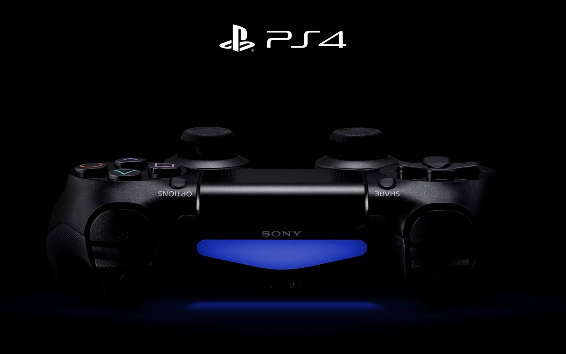 黑色PS4手掣在深色背景上發出藍光