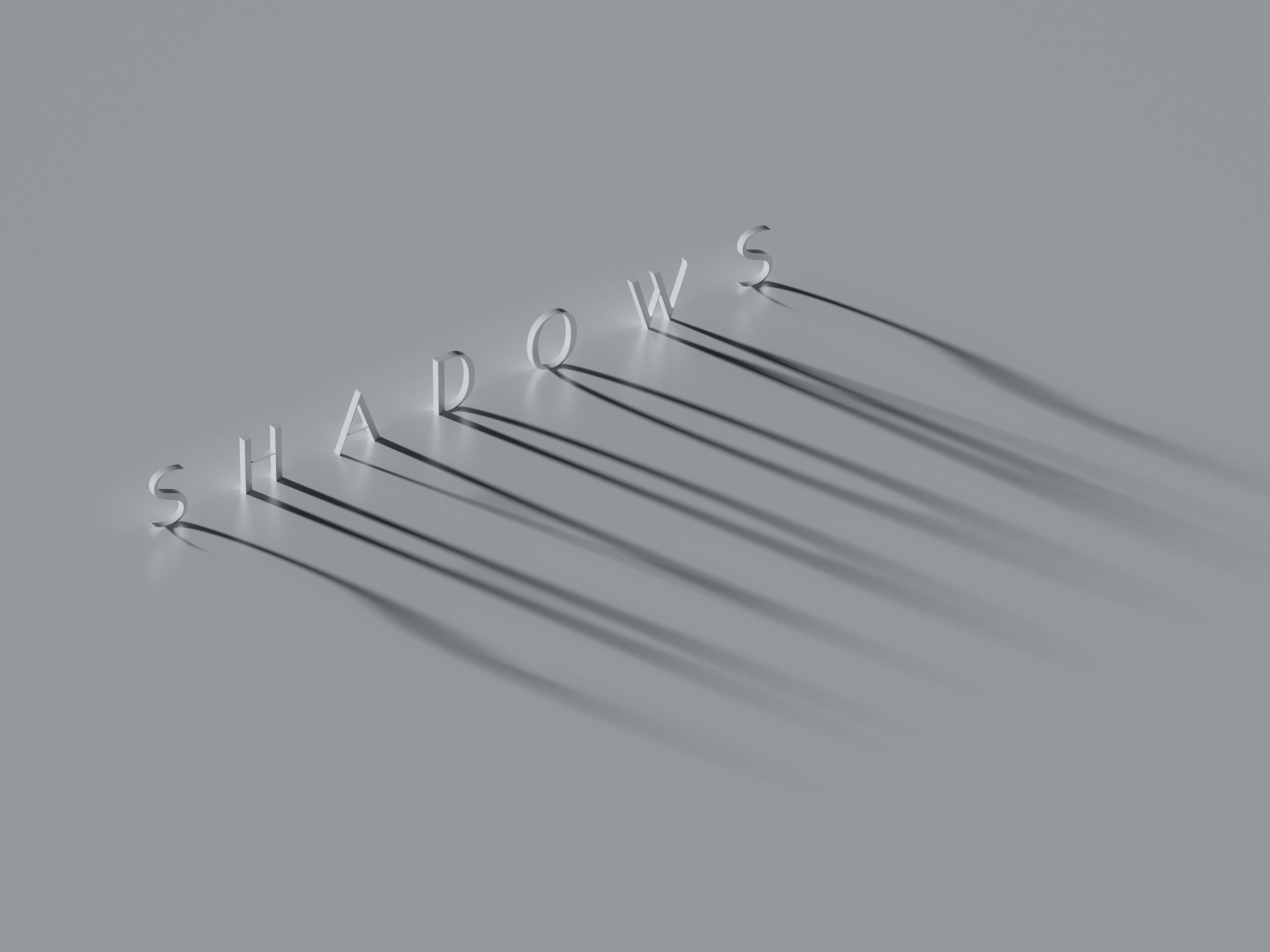 4K 影子字樣 壁紙 — 「SHADOWS」這個詞以時尚的金屬字母拼寫，在極簡的灰色表面上投射出長長的戲劇性陰影。