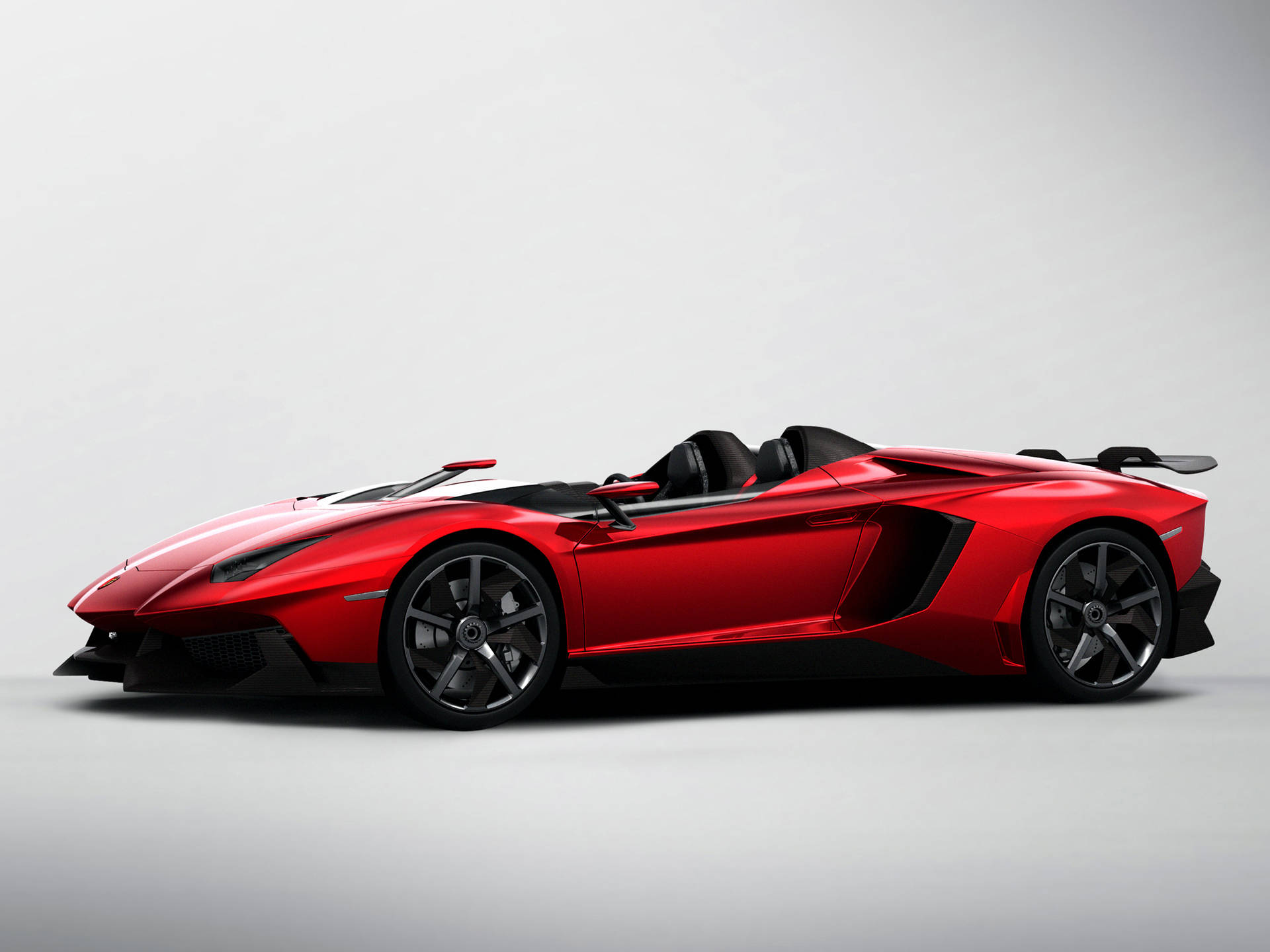 紅色林寶堅尼 Aventador Roadster，黑色內飾和車輪，白色工作室背景。