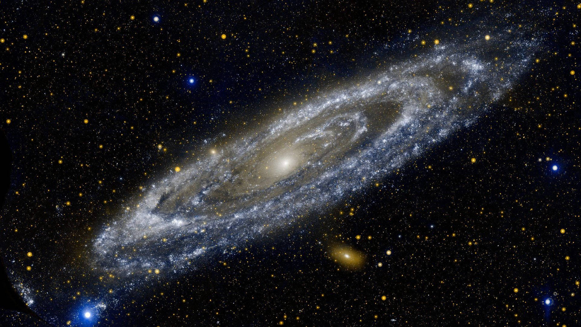 4K 超高清銀河天體 壁紙 — 一個雄偉的螺旋星系在星場中閃耀著由恆星和宇宙塵埃組成的旋轉臂。