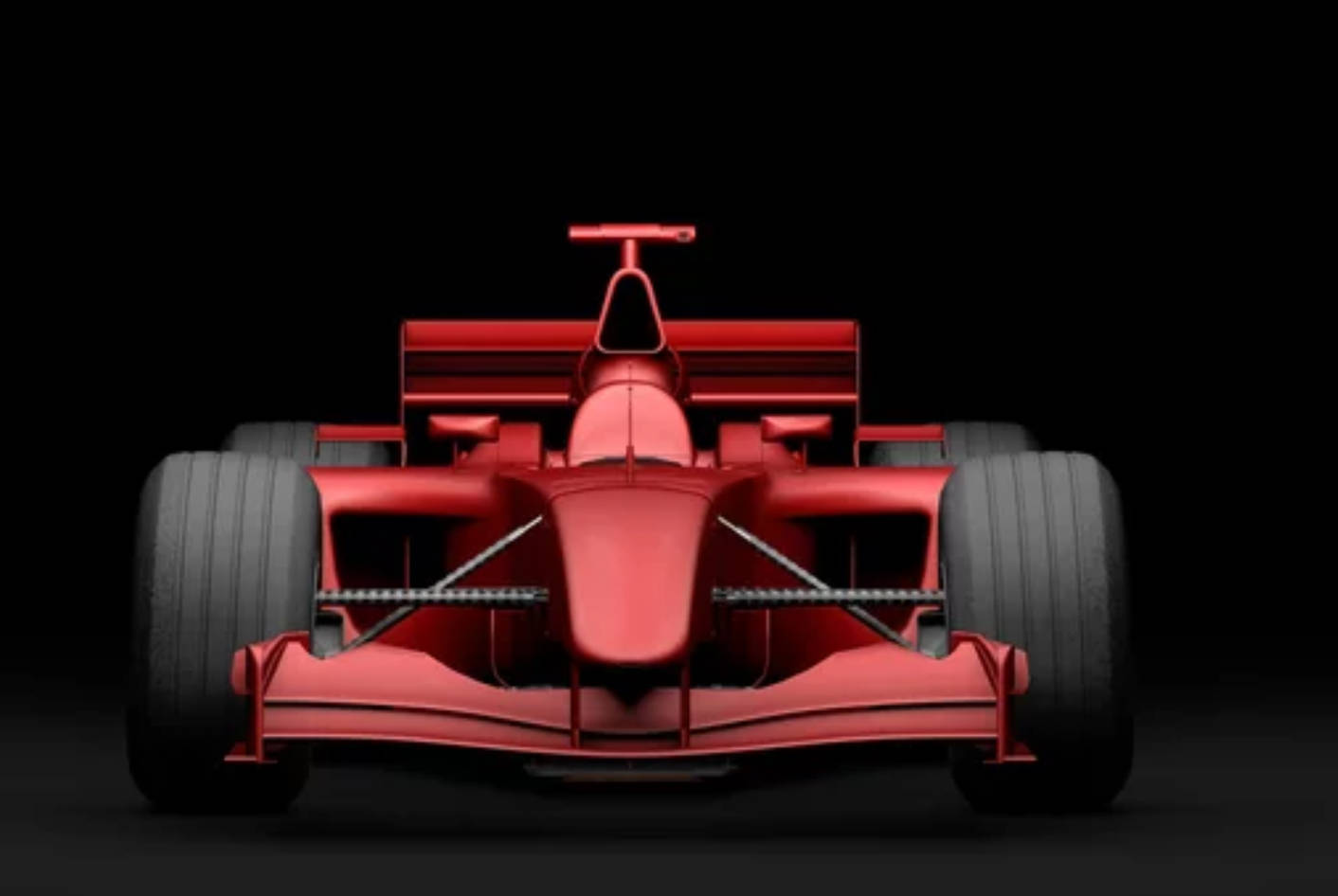 4K高畫質F1賽車高速競速 壁紙 — 一架時尚的紅色一級方程式賽車正面朝向純黑色背景，其空氣動力學設計和寬輪胎在戲劇性的工作室燈光下凸顯出來。