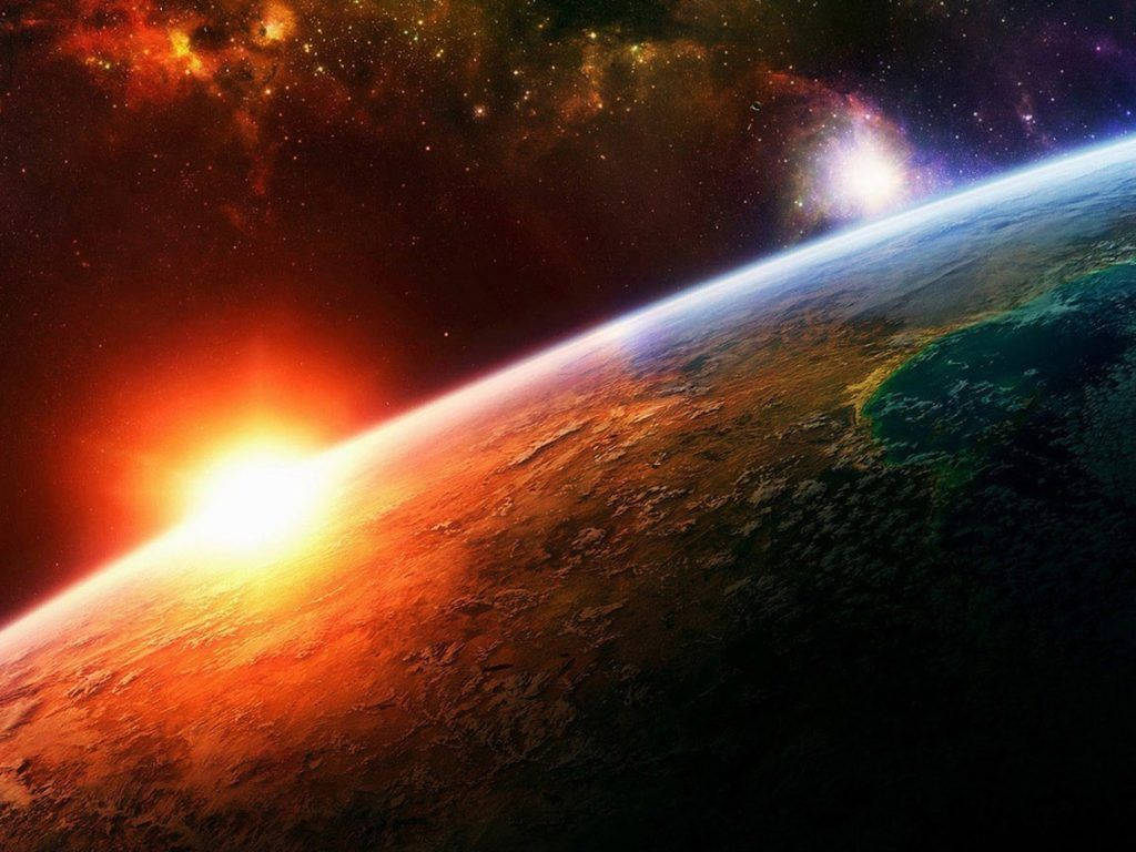 從太空觀看地球在日出時的情景，發光的地平線和星空。