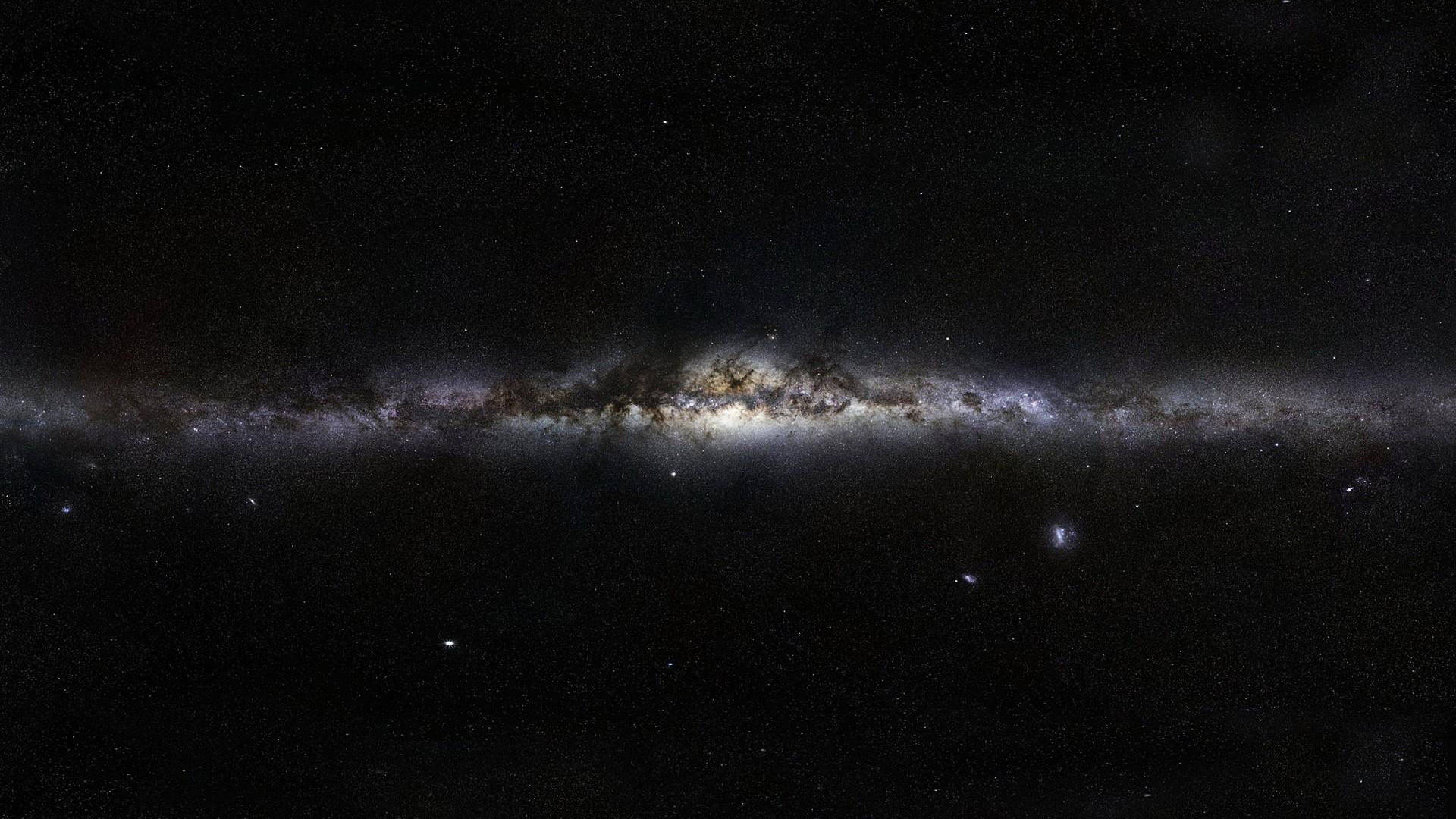 銀河系，帶有發光的星雲和黑暗的塵埃帶，背景是繁星點點的宇宙。 — 4K太空 壁紙