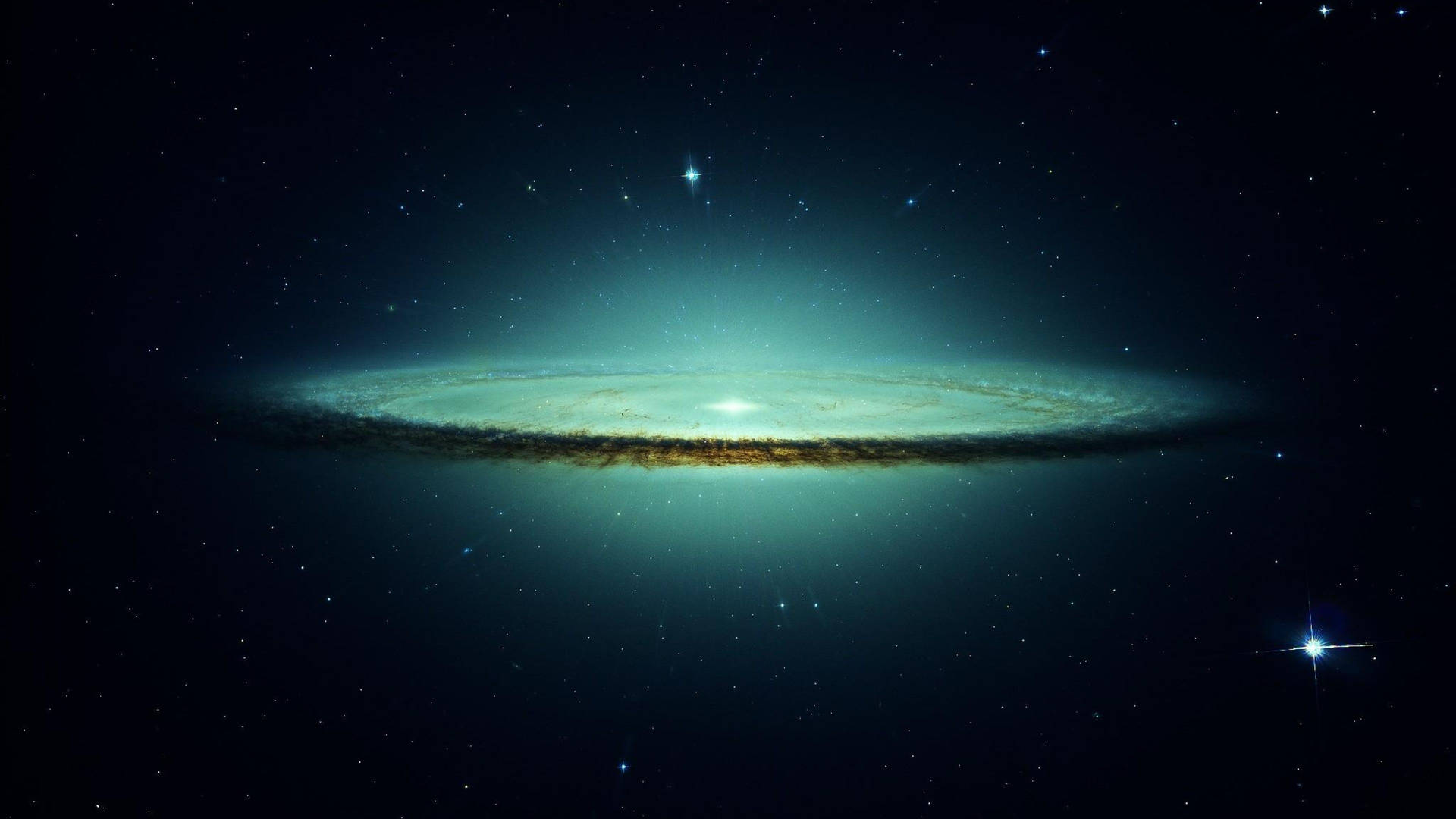 一個發光的螺旋星系，帶有藍綠色和金色的旋臂，被星星環繞。