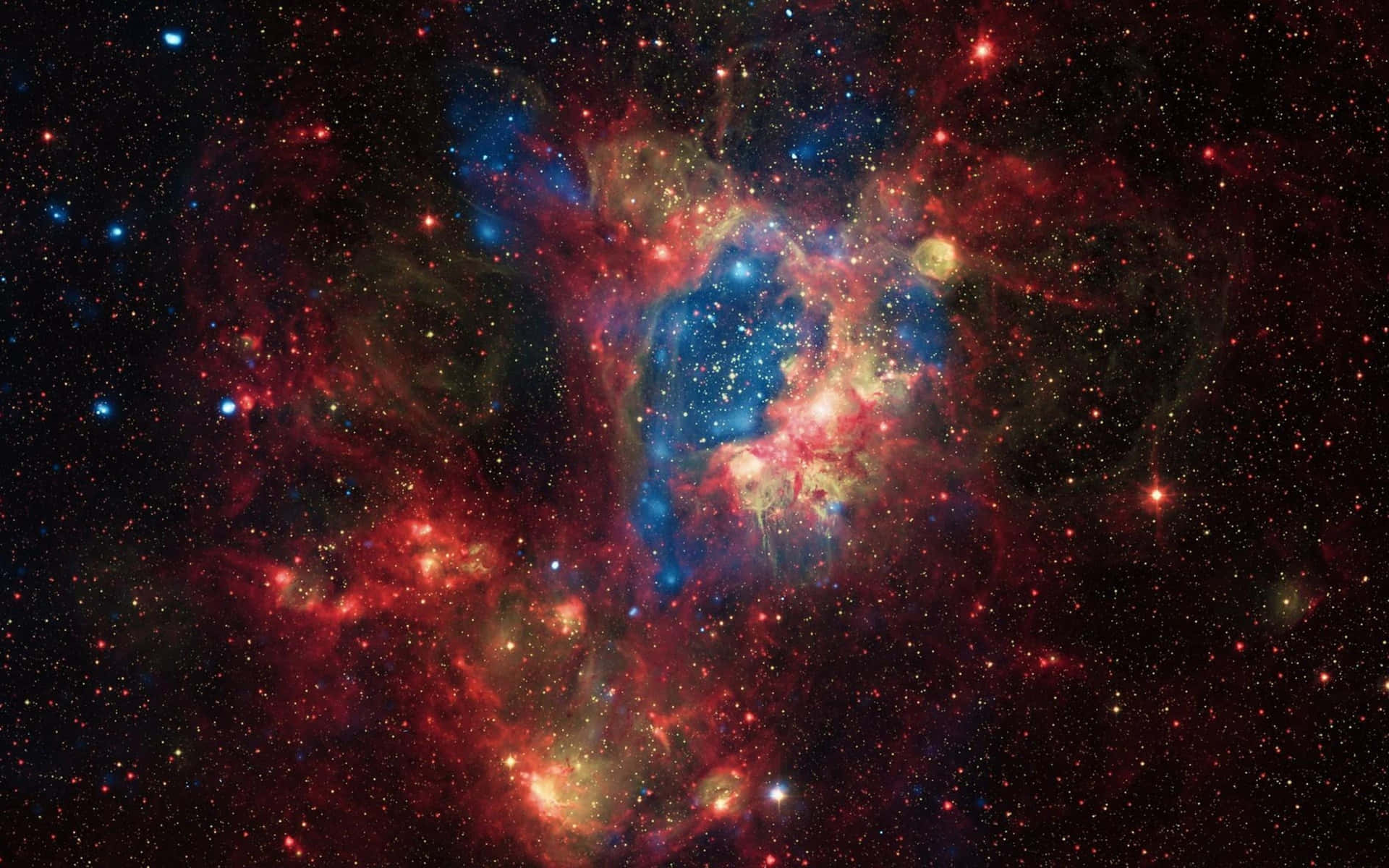 在深空中與星星一起發光的充滿活力的紅色、藍色和金色星雲。