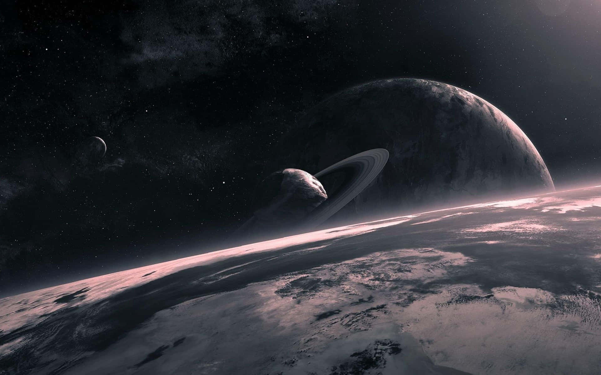一顆環狀行星在星空下升起於雪白的外星世界之上。