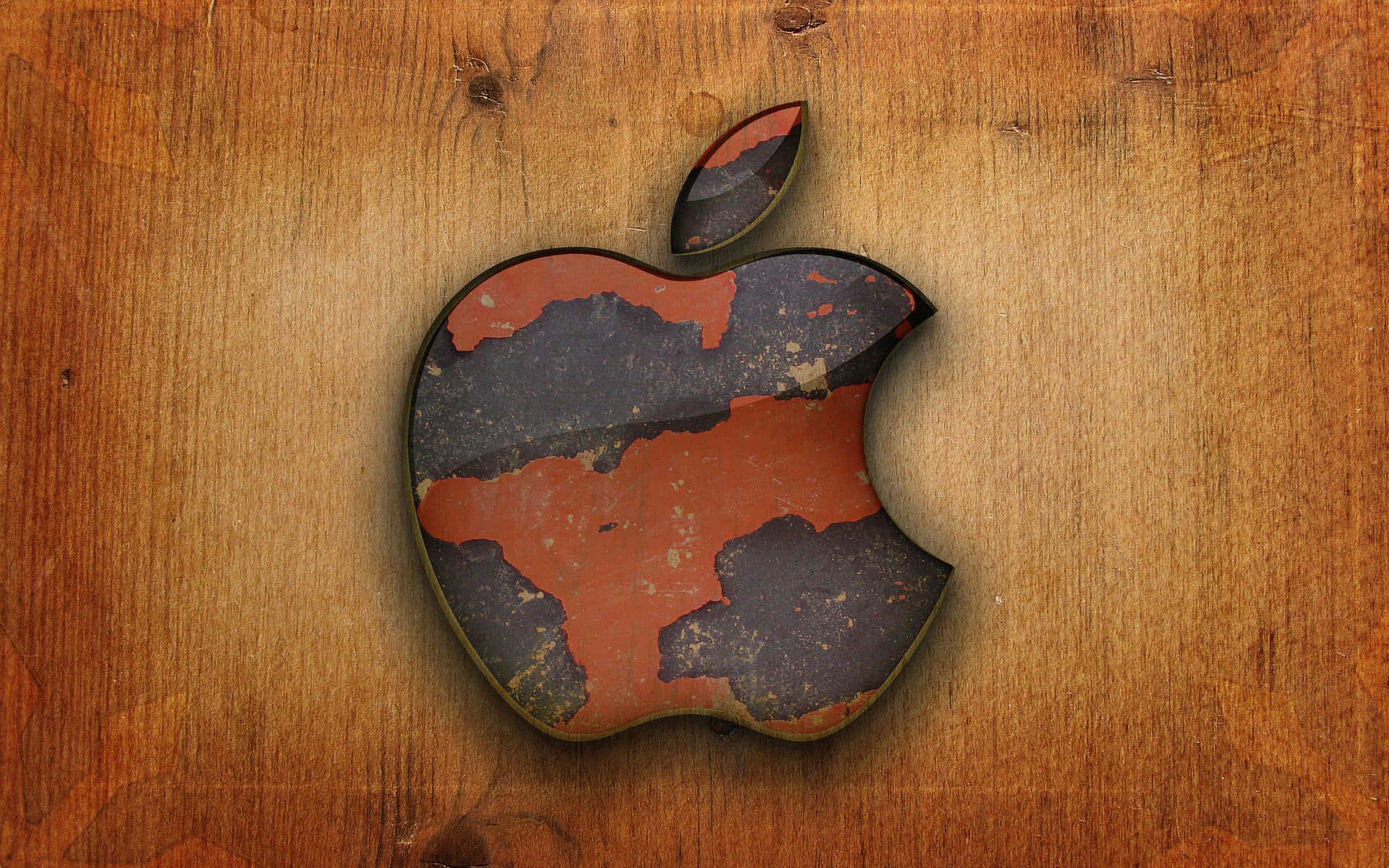 木質背景上油漆剝落的磨損Apple標誌。