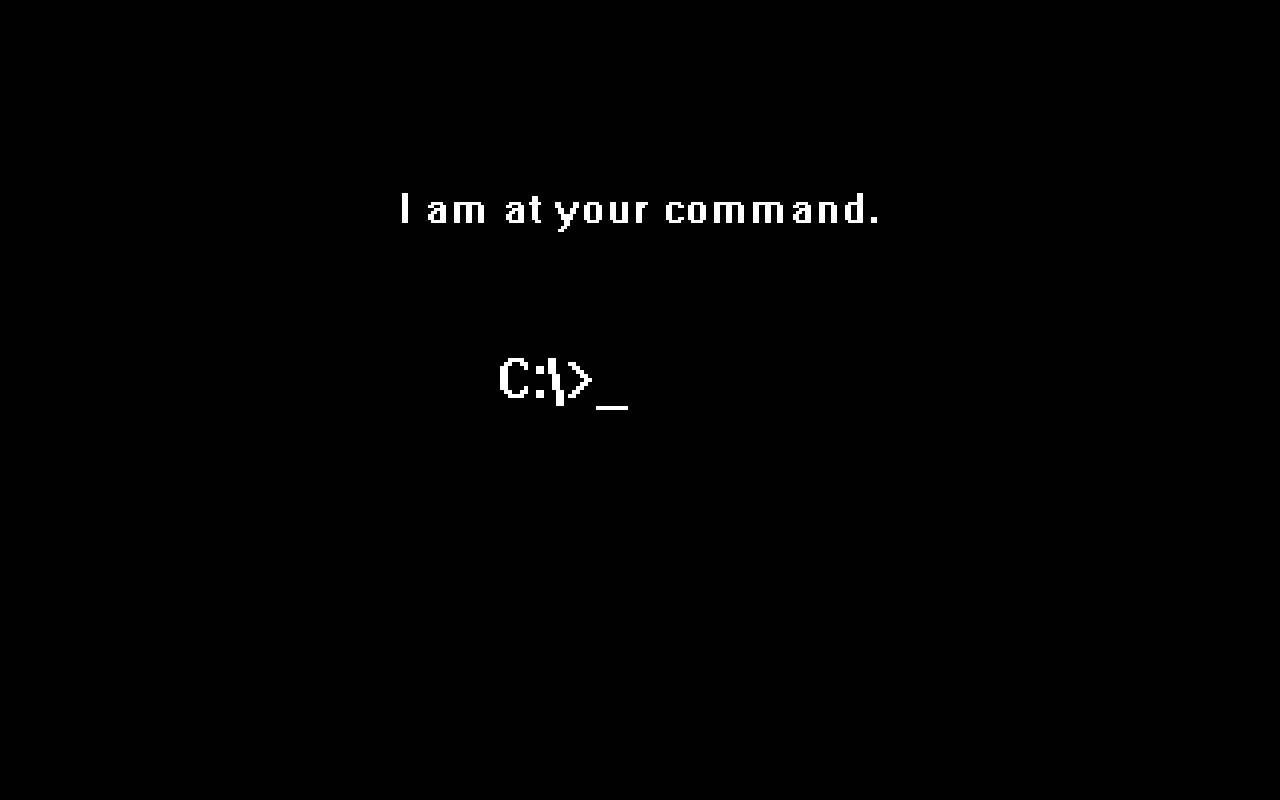 黑色螢幕帶有白色像素化文字「I am at your command.」和「C:>_」。