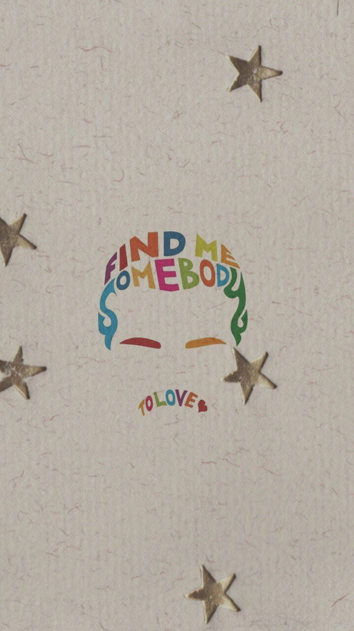 奇幻的彩虹文字藝術，帶有金色星星，印在紋理紙上，寫著「Find Me Somebody To Love」。