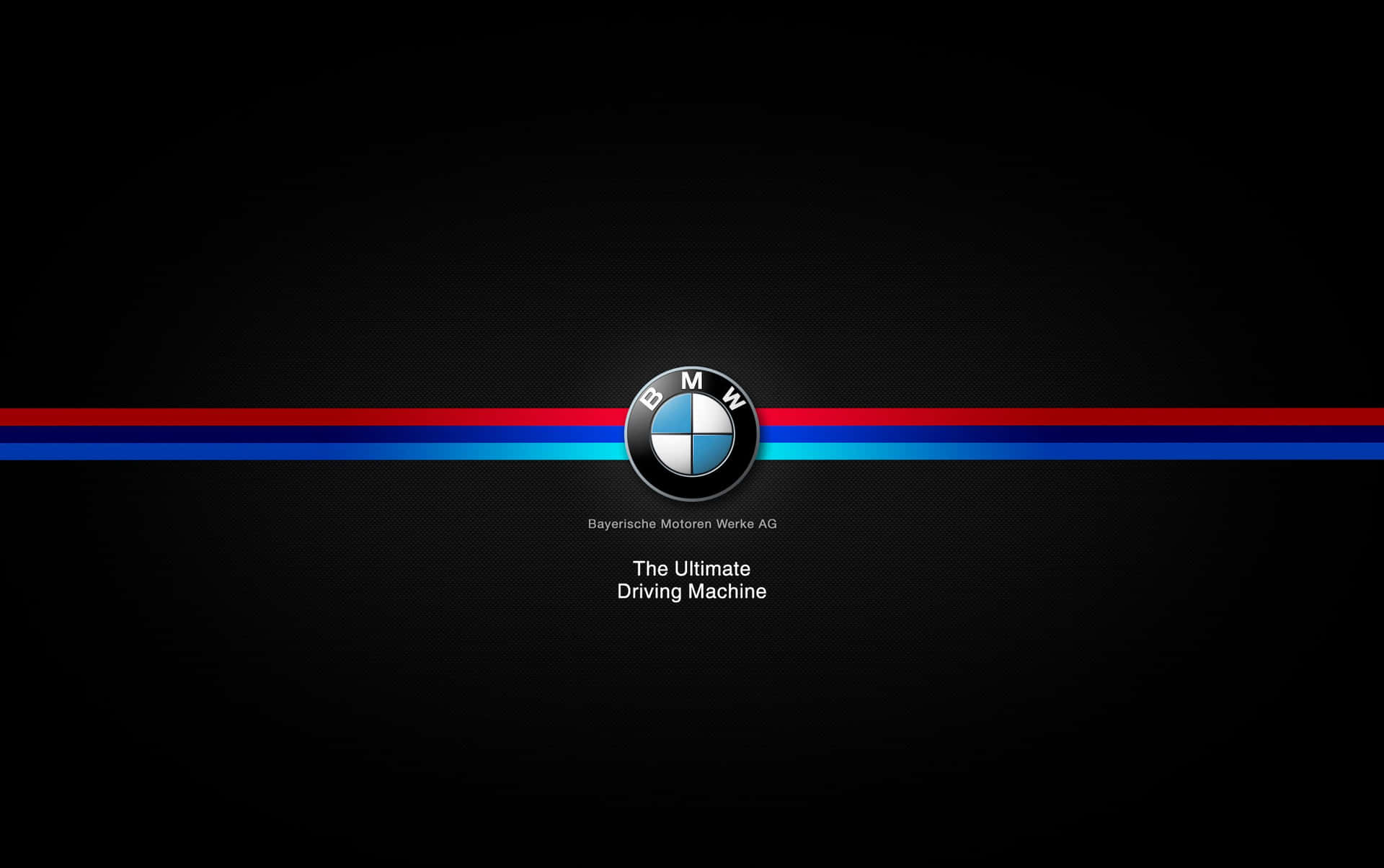 BMW 標誌帶有紅色、藍色和淺藍色條紋及標語 The Ultimate Driving Machine，位於黑色背景上。